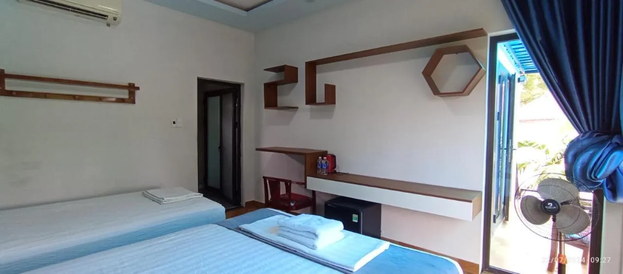 Bed in Palafita Bungalow