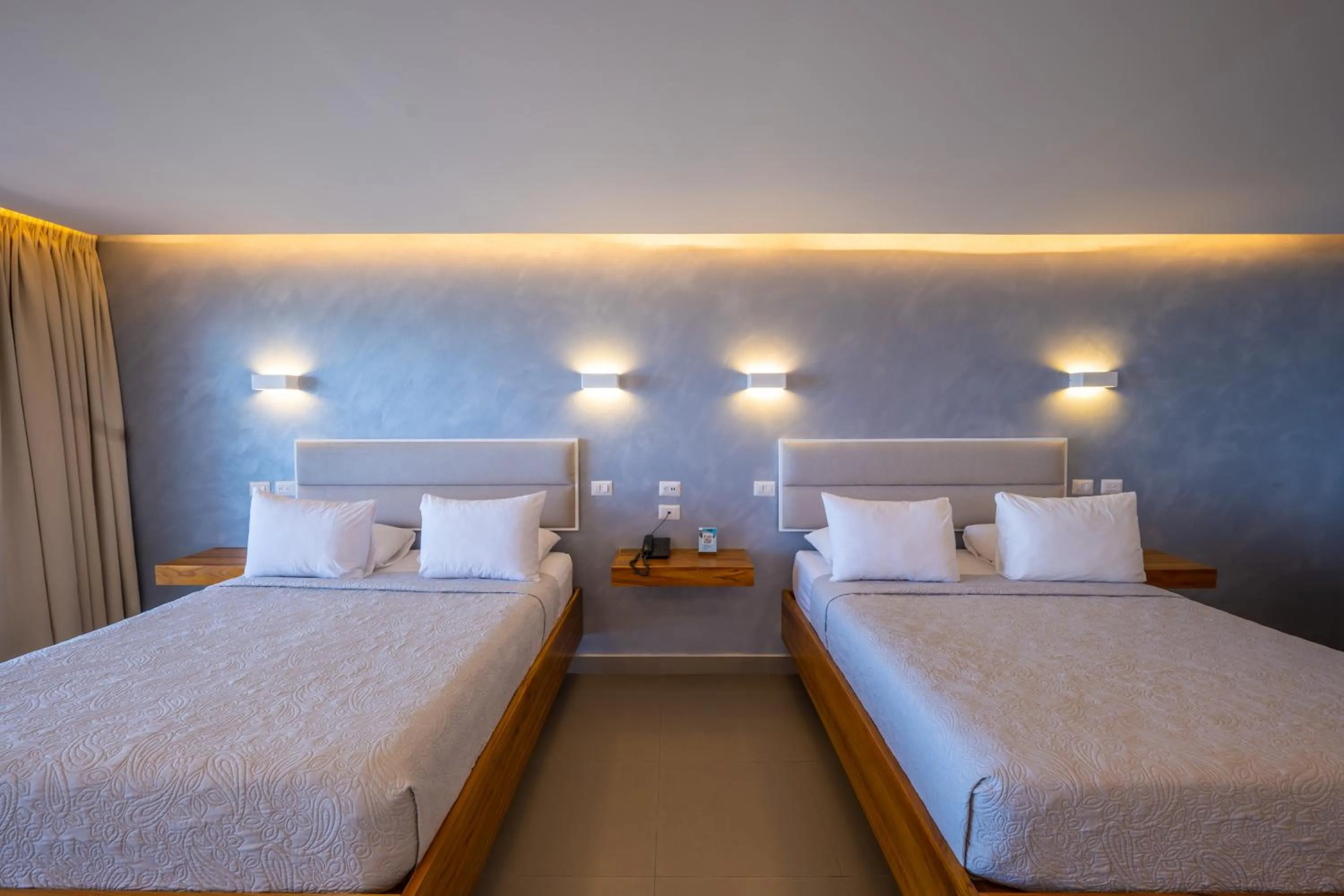 Bed in Hotel La Mariposa