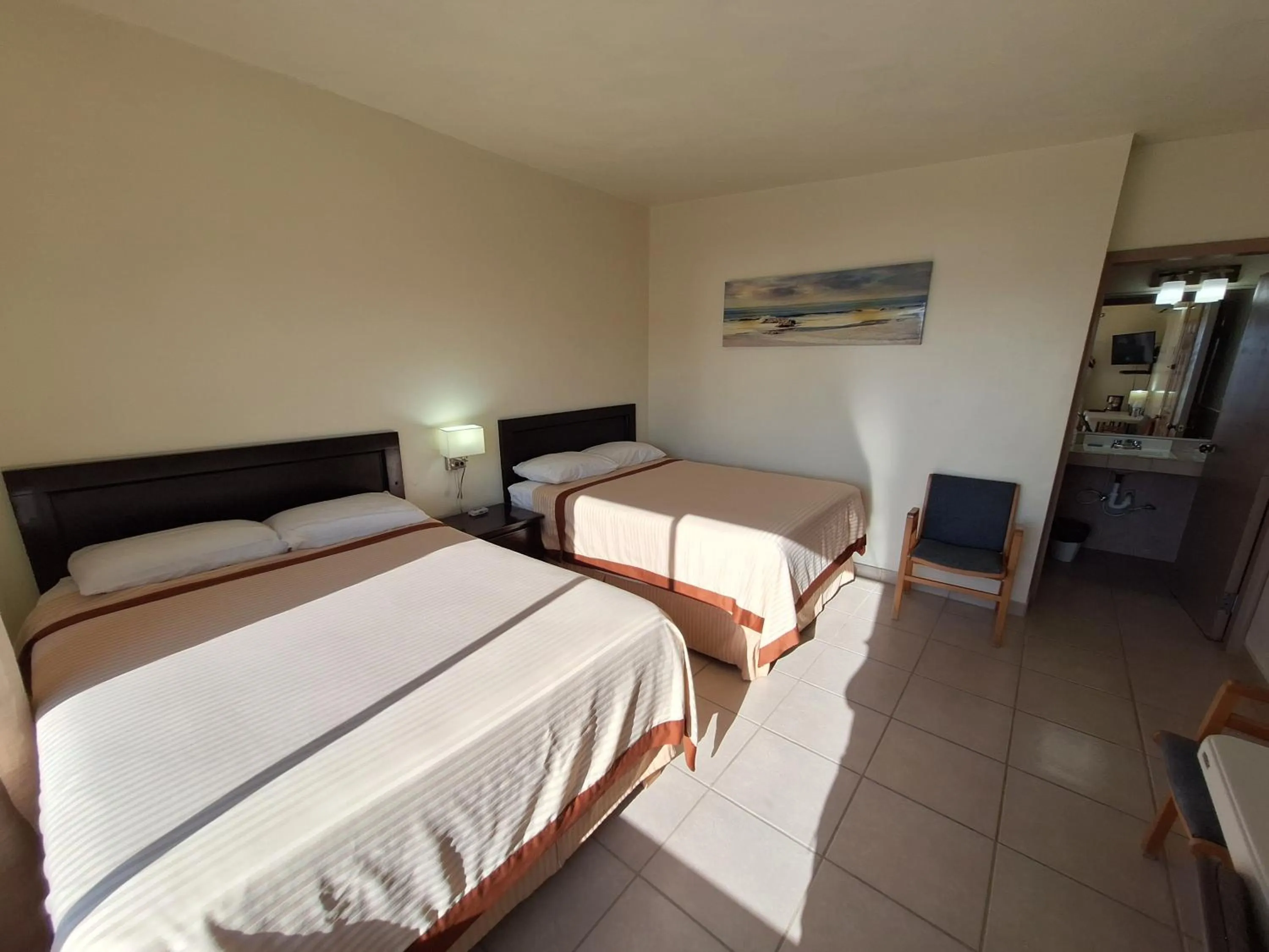 Bed in #53 Bungalow Seaside Hotel & Victors RV Park