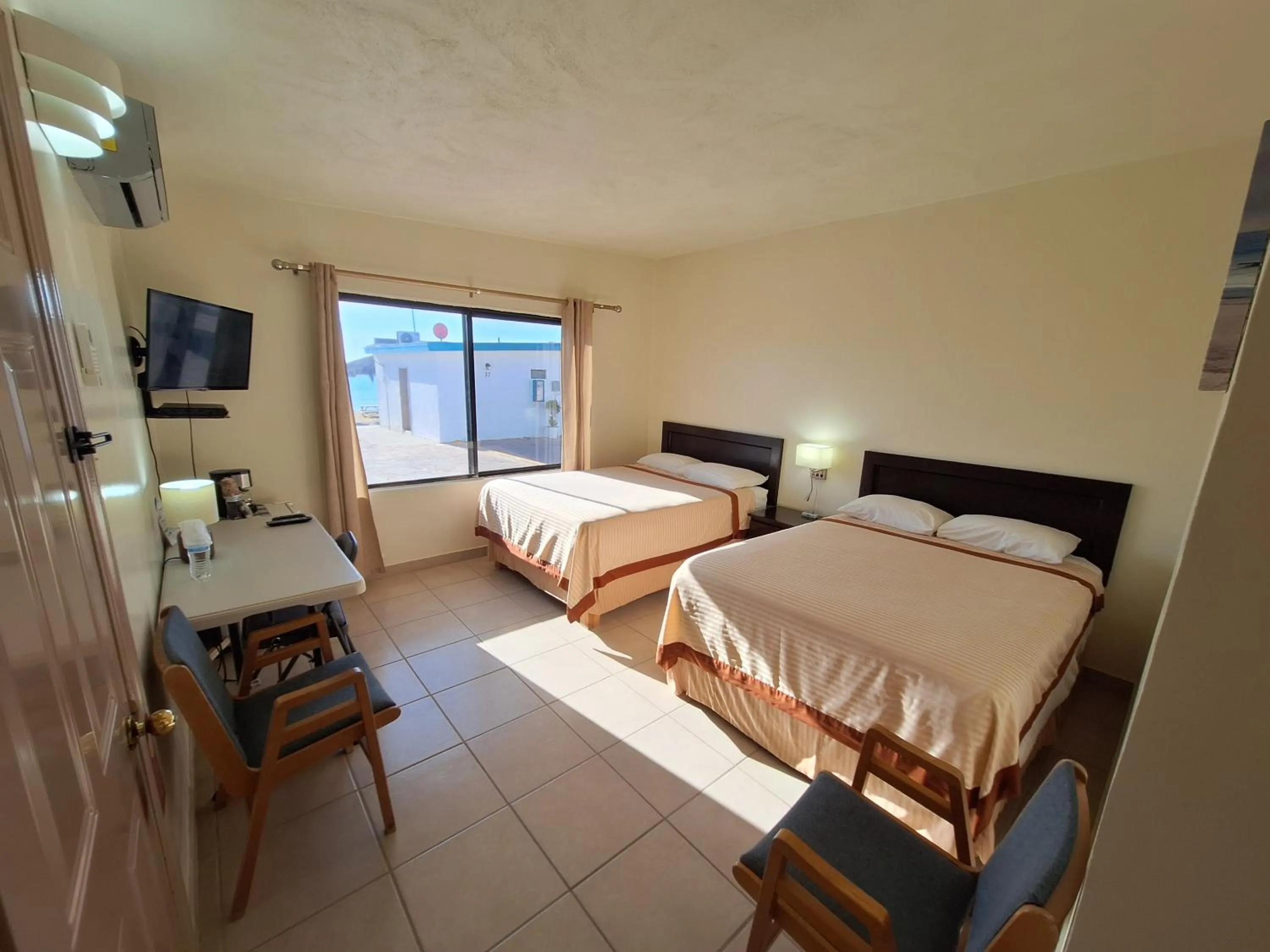 Bed in #53 Bungalow Seaside Hotel & Victors RV Park