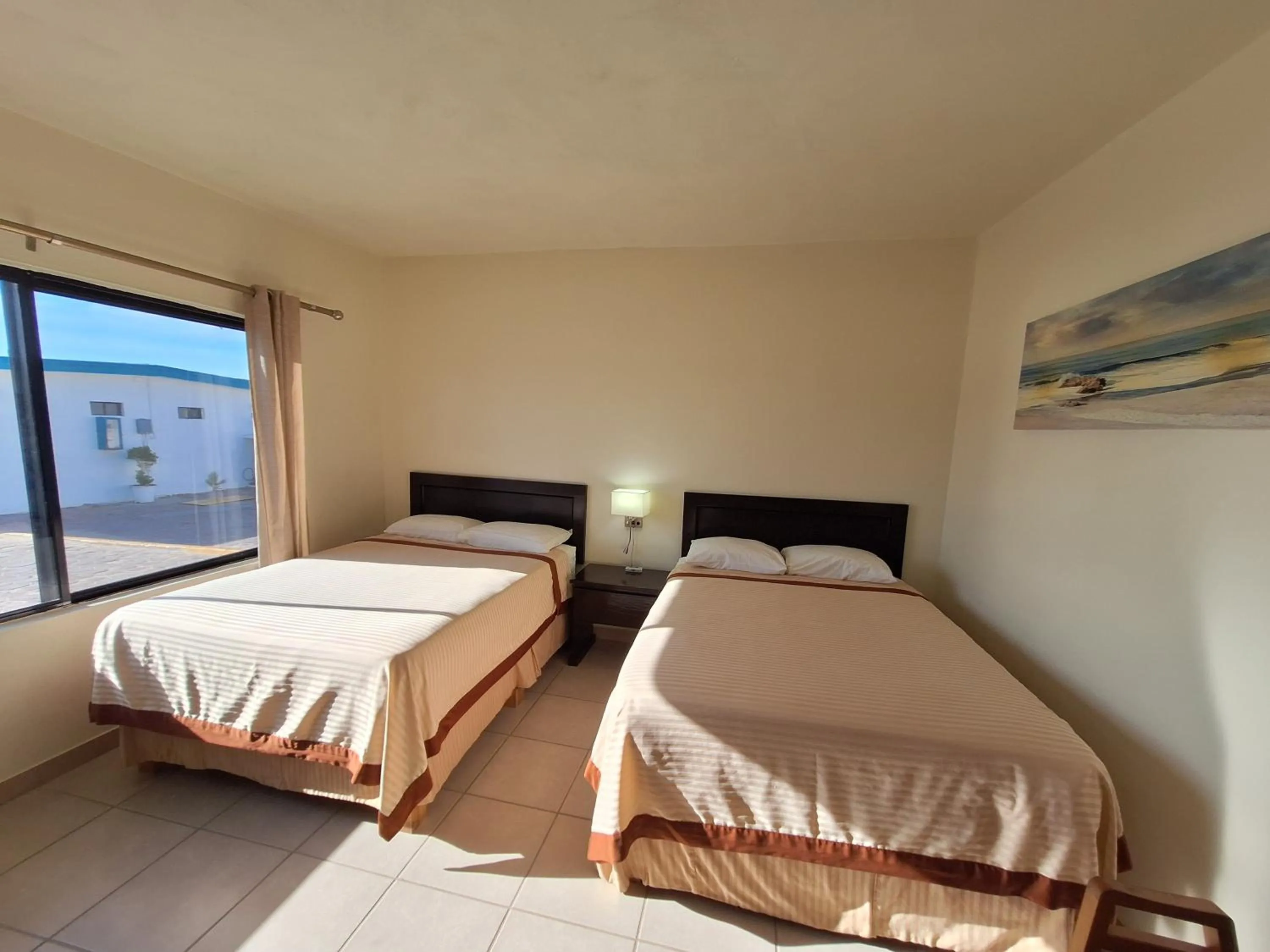 Bed in #53 Bungalow Seaside Hotel & Victors RV Park