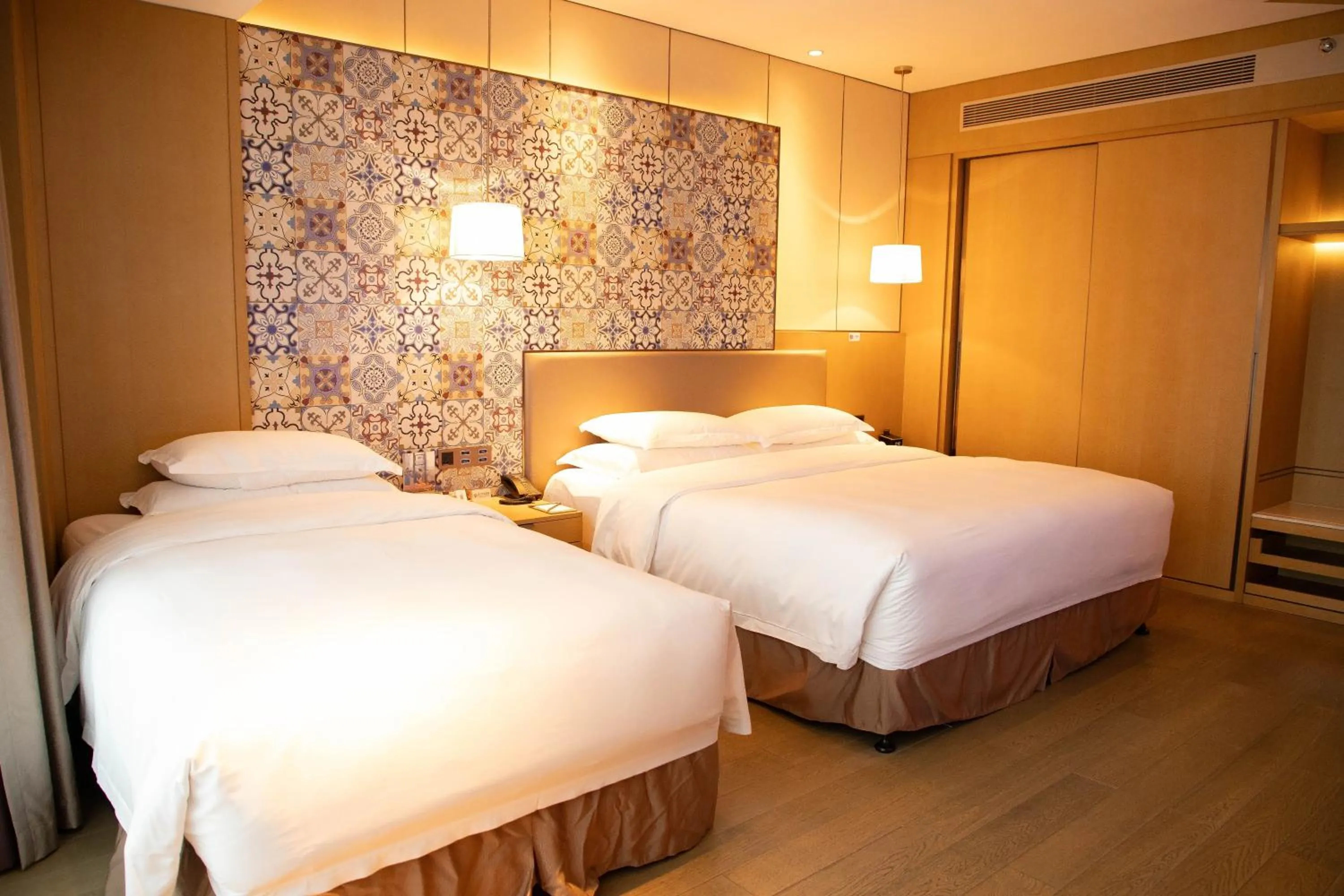 Bed in Wyndham Grand Plaza Royale Yuzhou Xiamen Wuyuan Bay