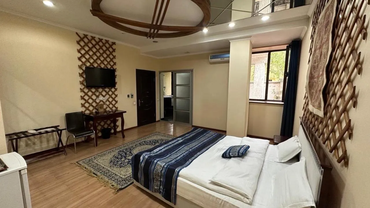 Bed in Tian-Shan Hotel