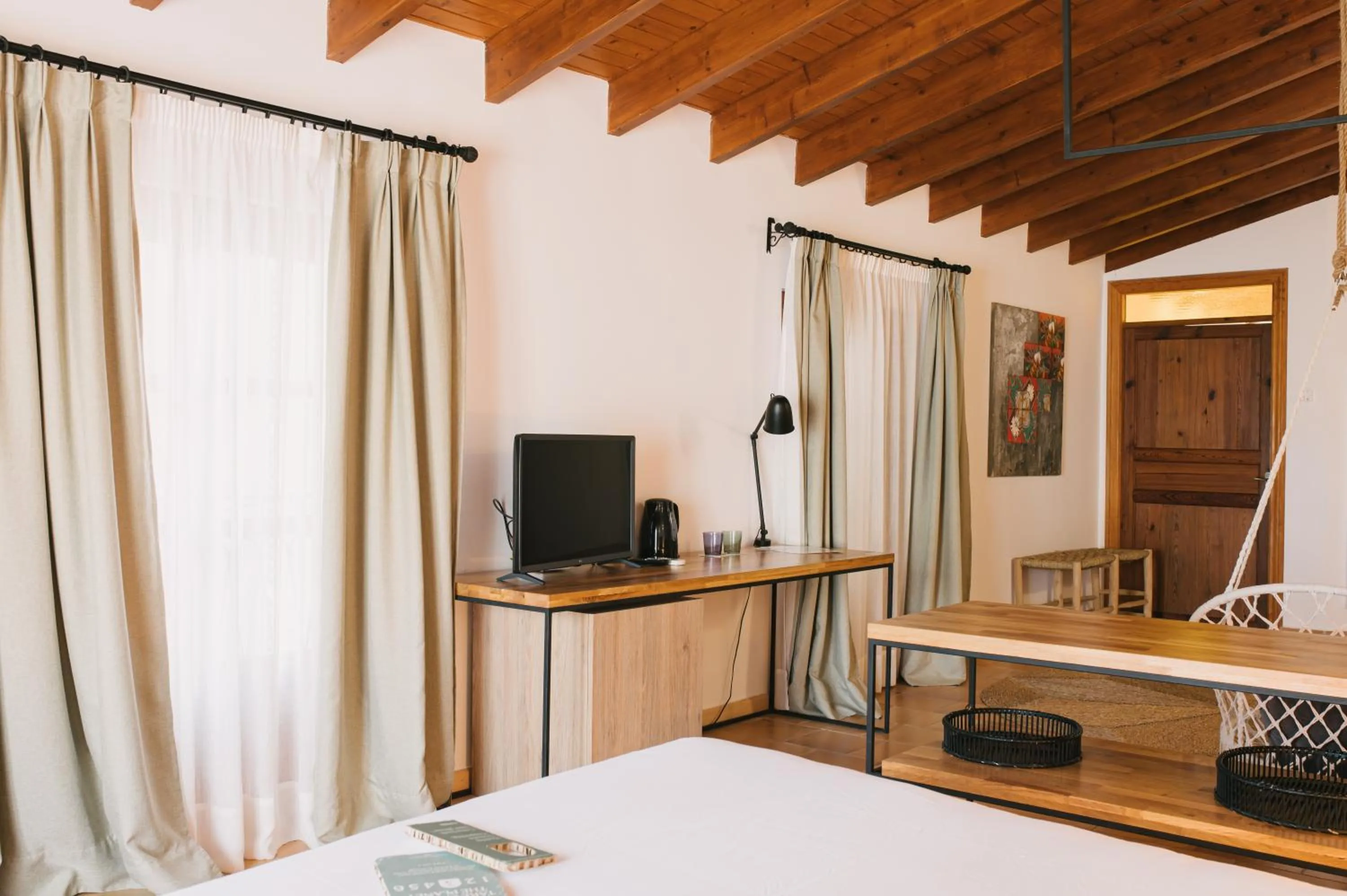 Bed in Curolla Petit Hotel