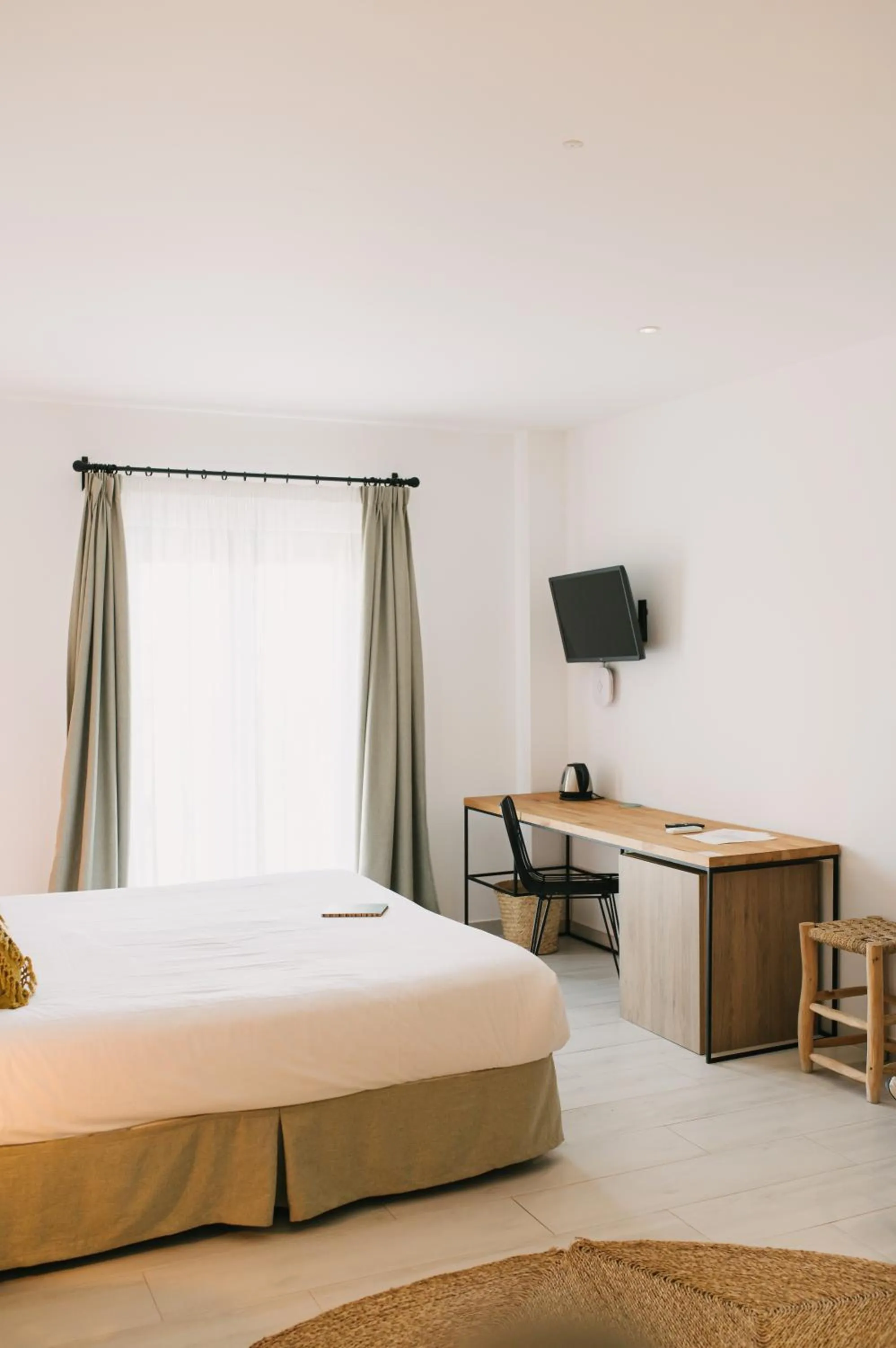 Bed in Curolla Petit Hotel