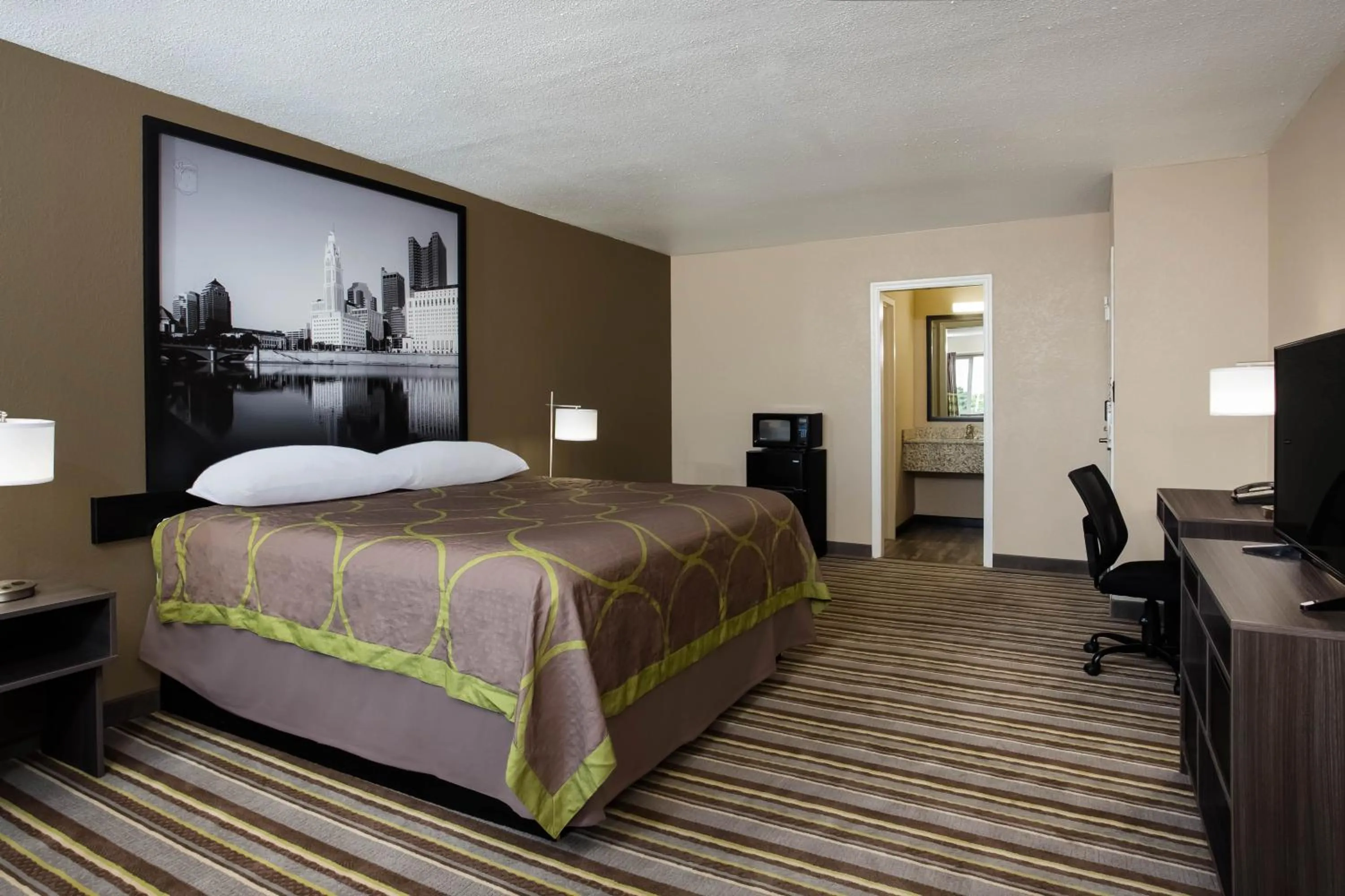 Photo of the whole room, Bed in Travel Inn Of Sidney Ohio