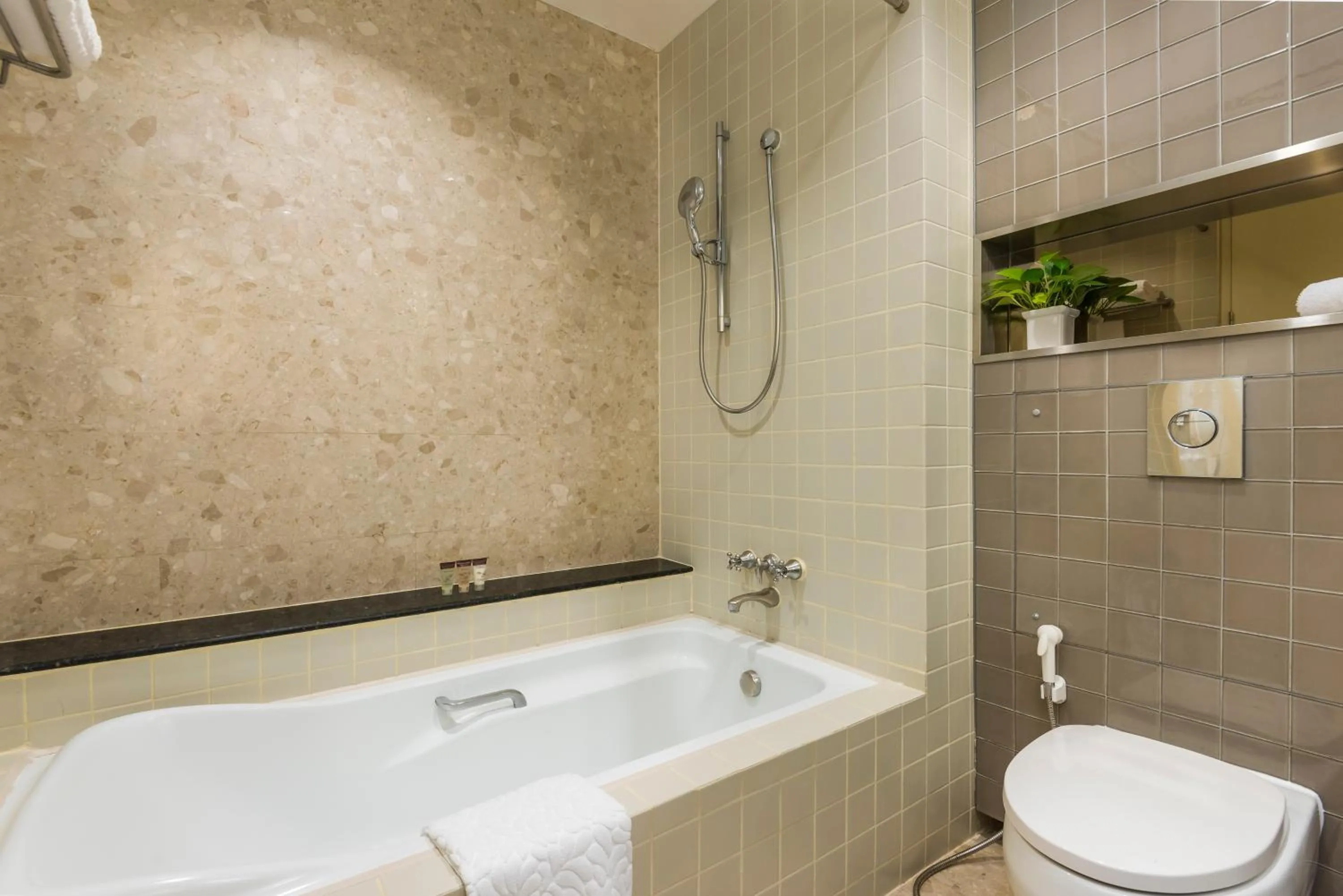 Toilet in Emporium Suites by Chatrium