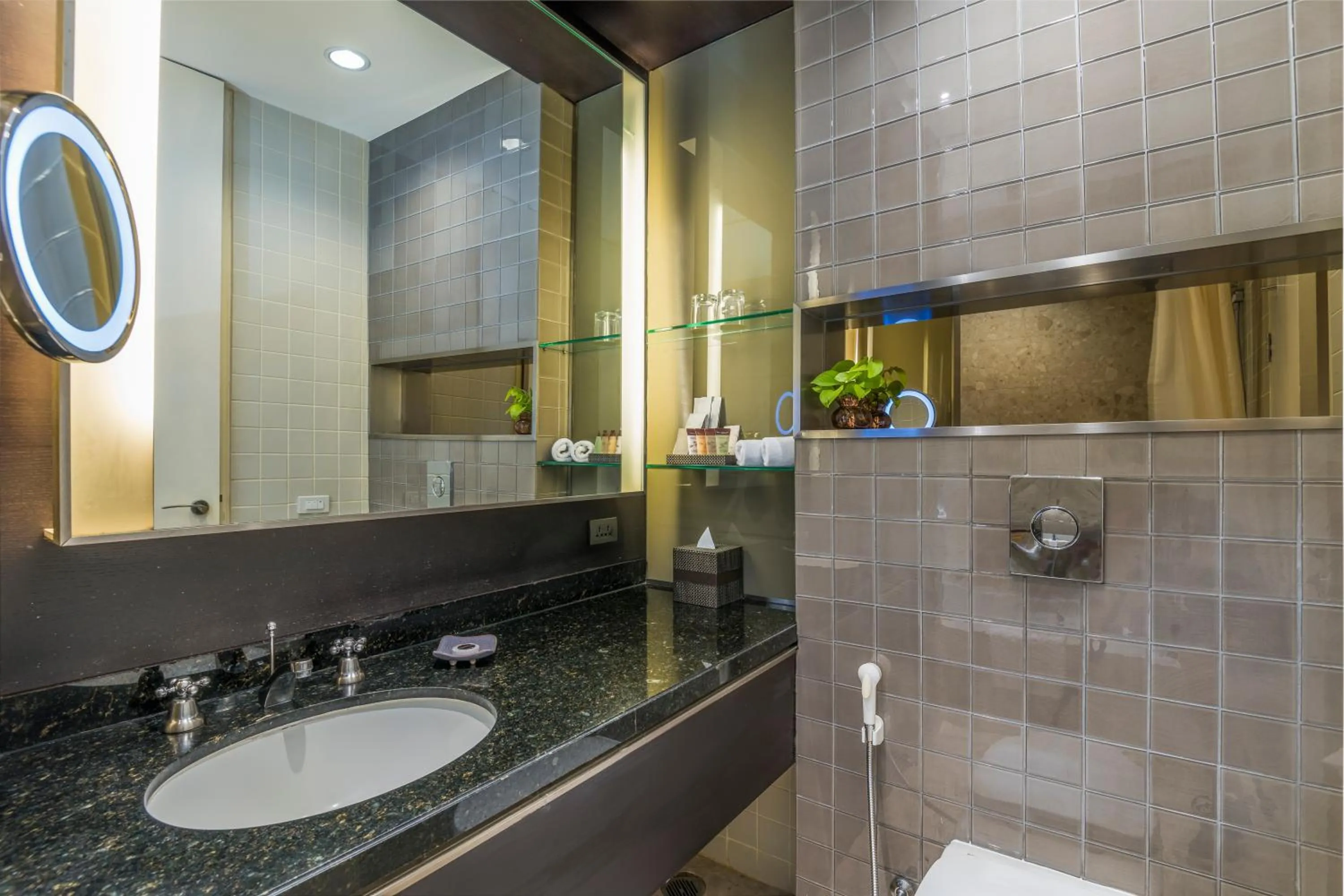 Toilet in Emporium Suites by Chatrium