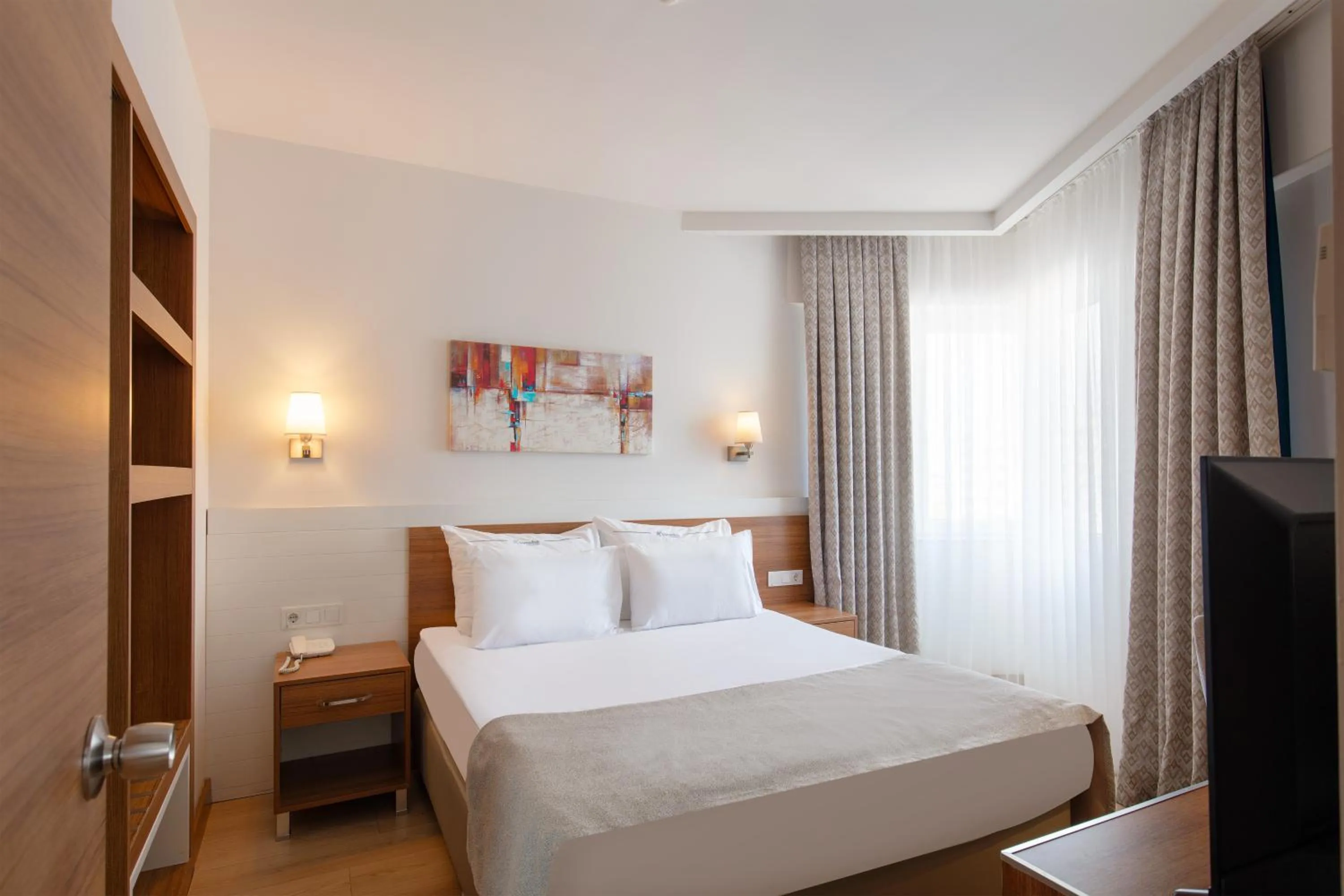 Bed in Grand Park Lara Hotel