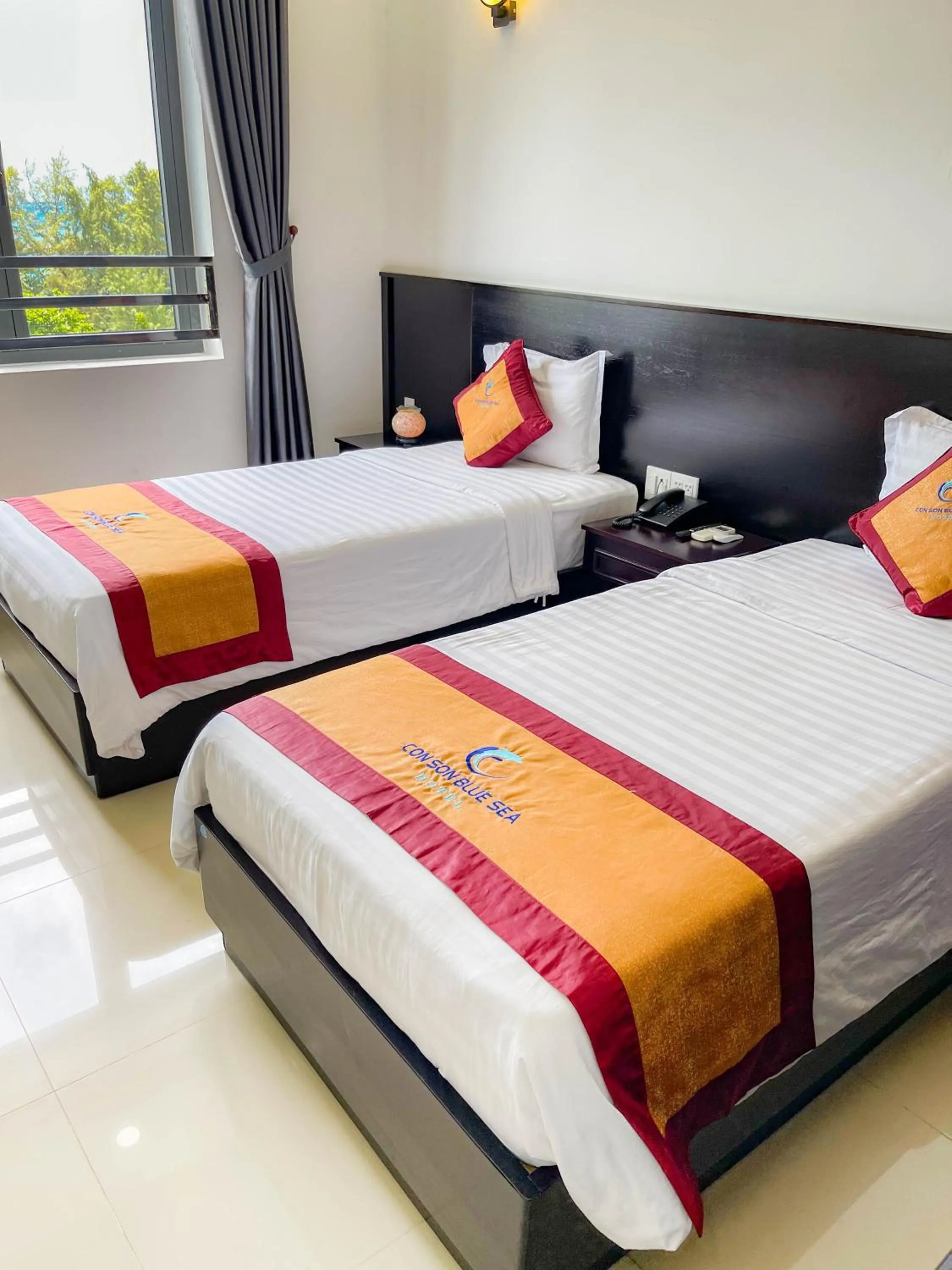 Bed in Con Son Blue Sea Hotel