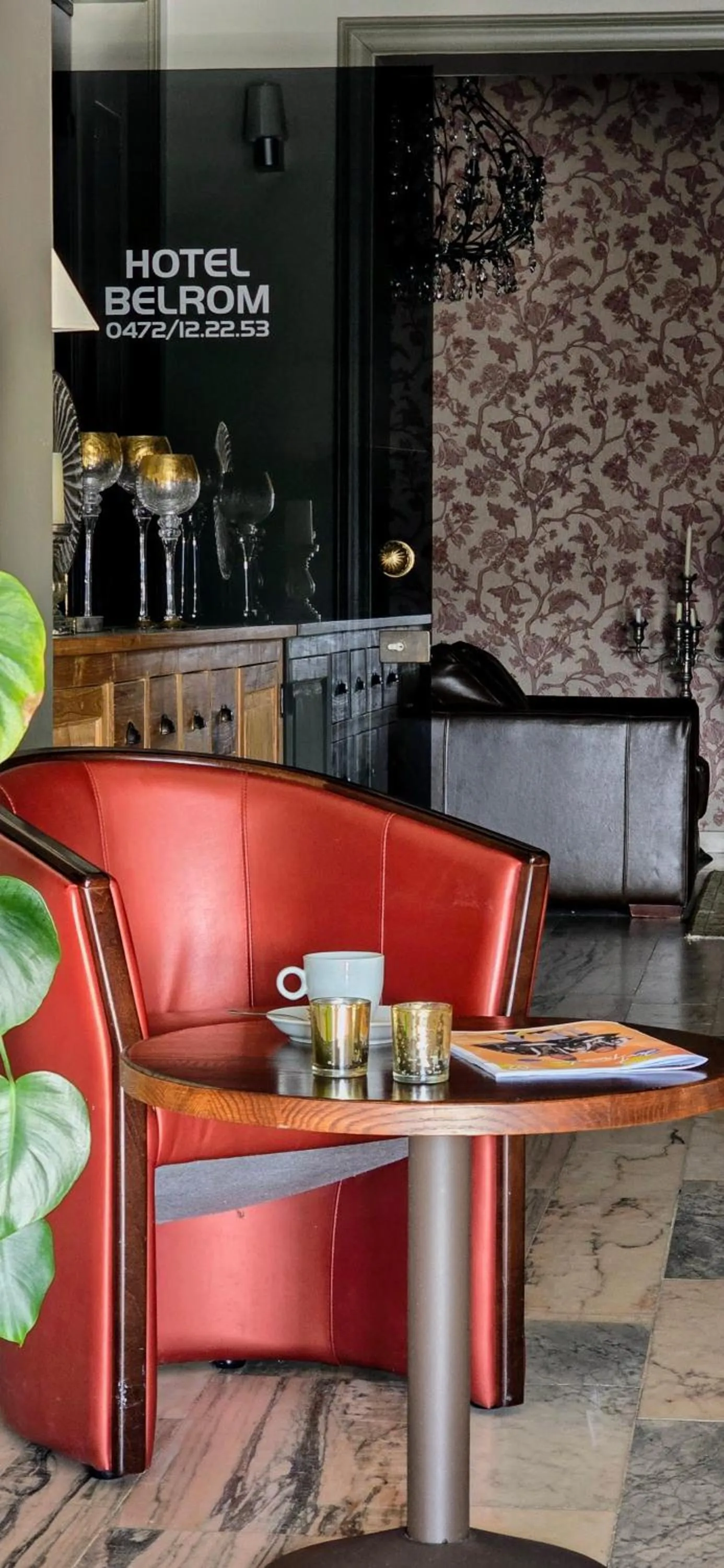 Communal lounge/ TV room in Belrom Hotel