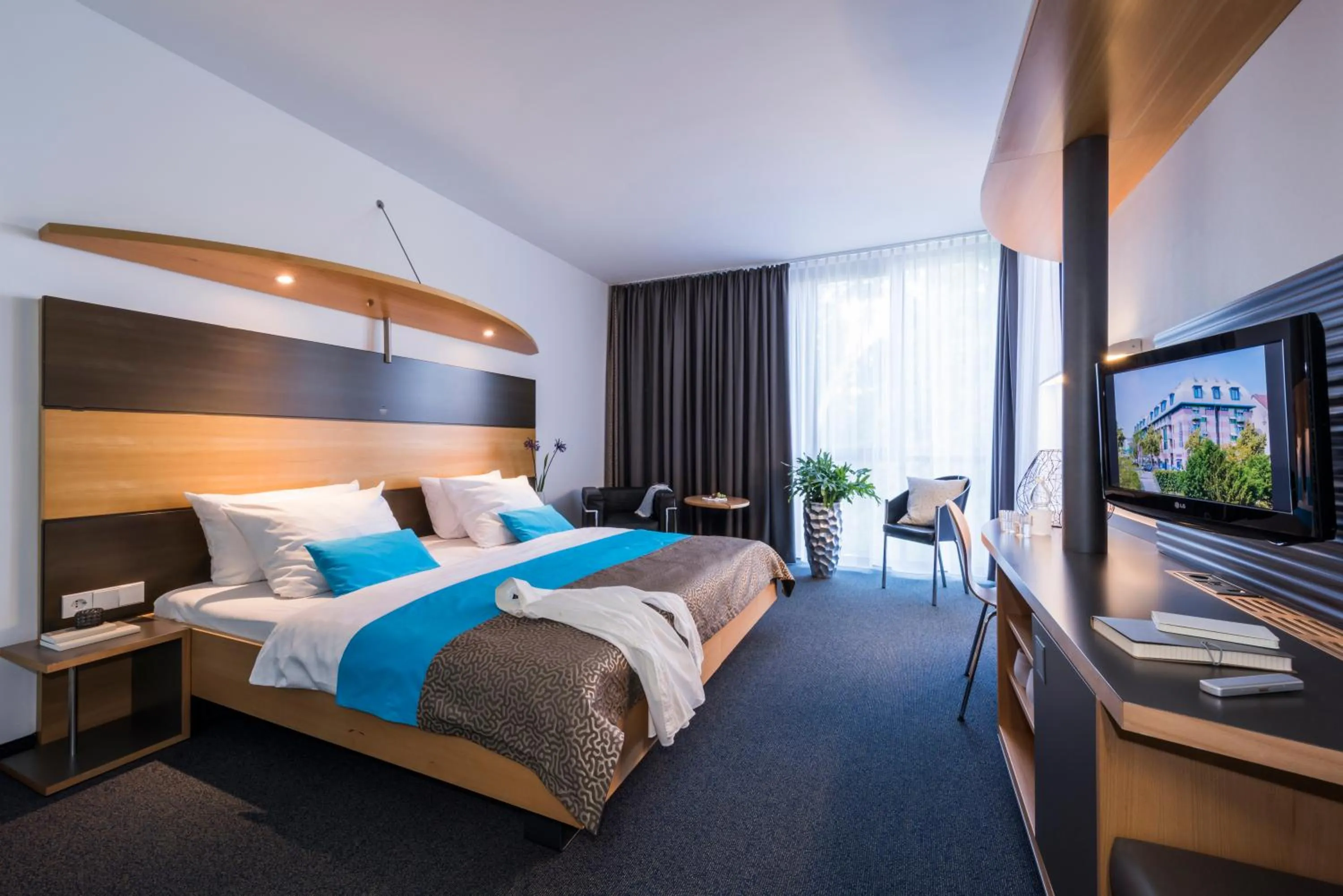 Photo of the whole room, Bed in SEEhotel Friedrichshafen