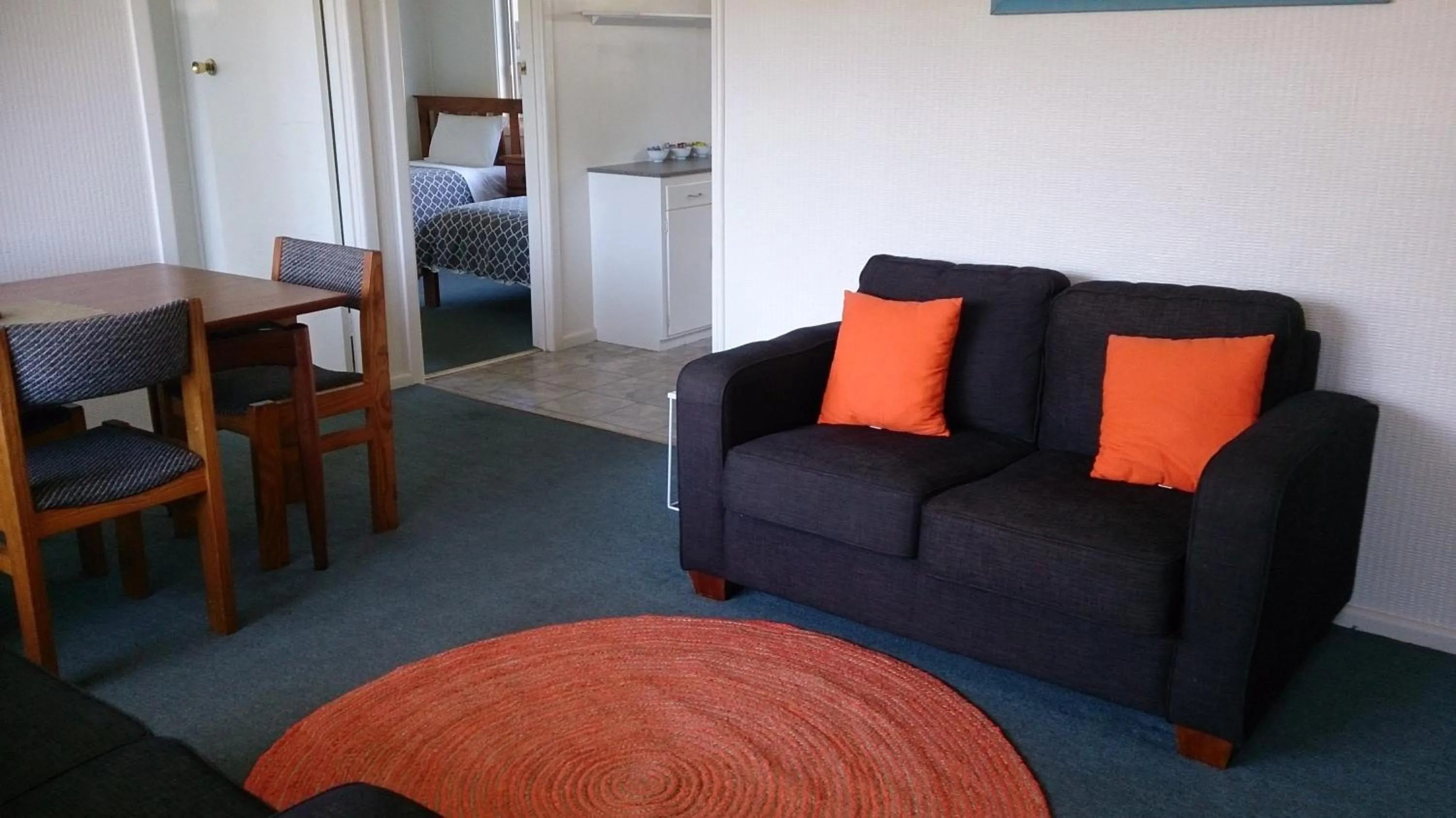 Living room, Bed in Phillip Island Cottages