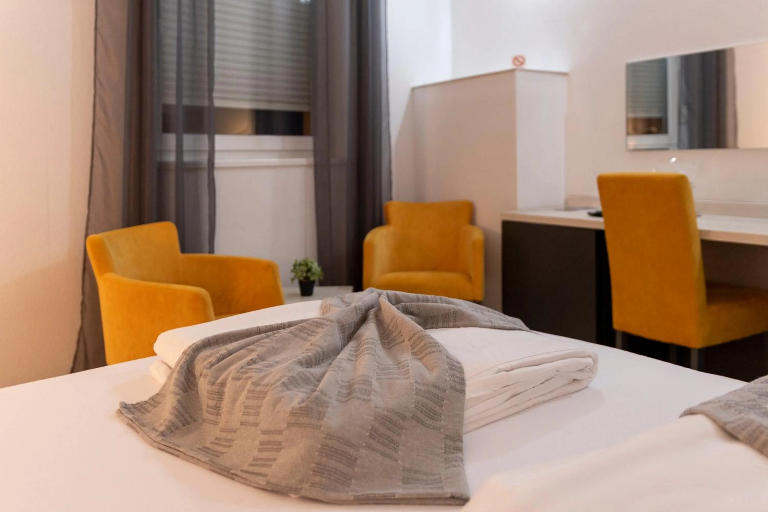 Bed in Garni Hotel 11tica DM