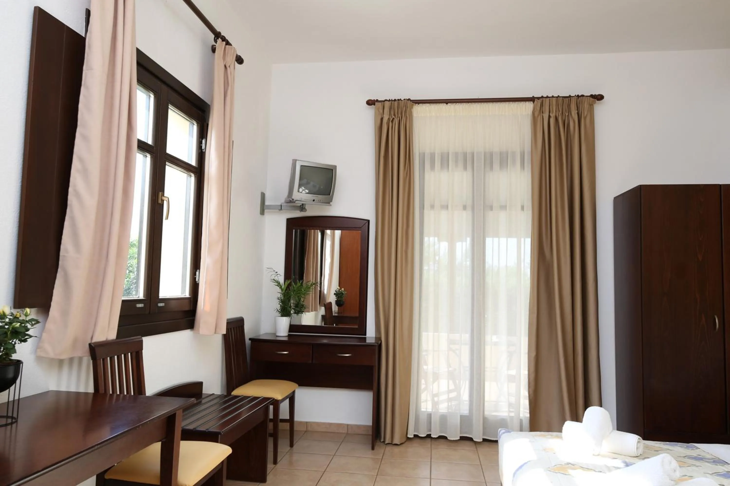 Bedroom in Palirria Hotel & Studios