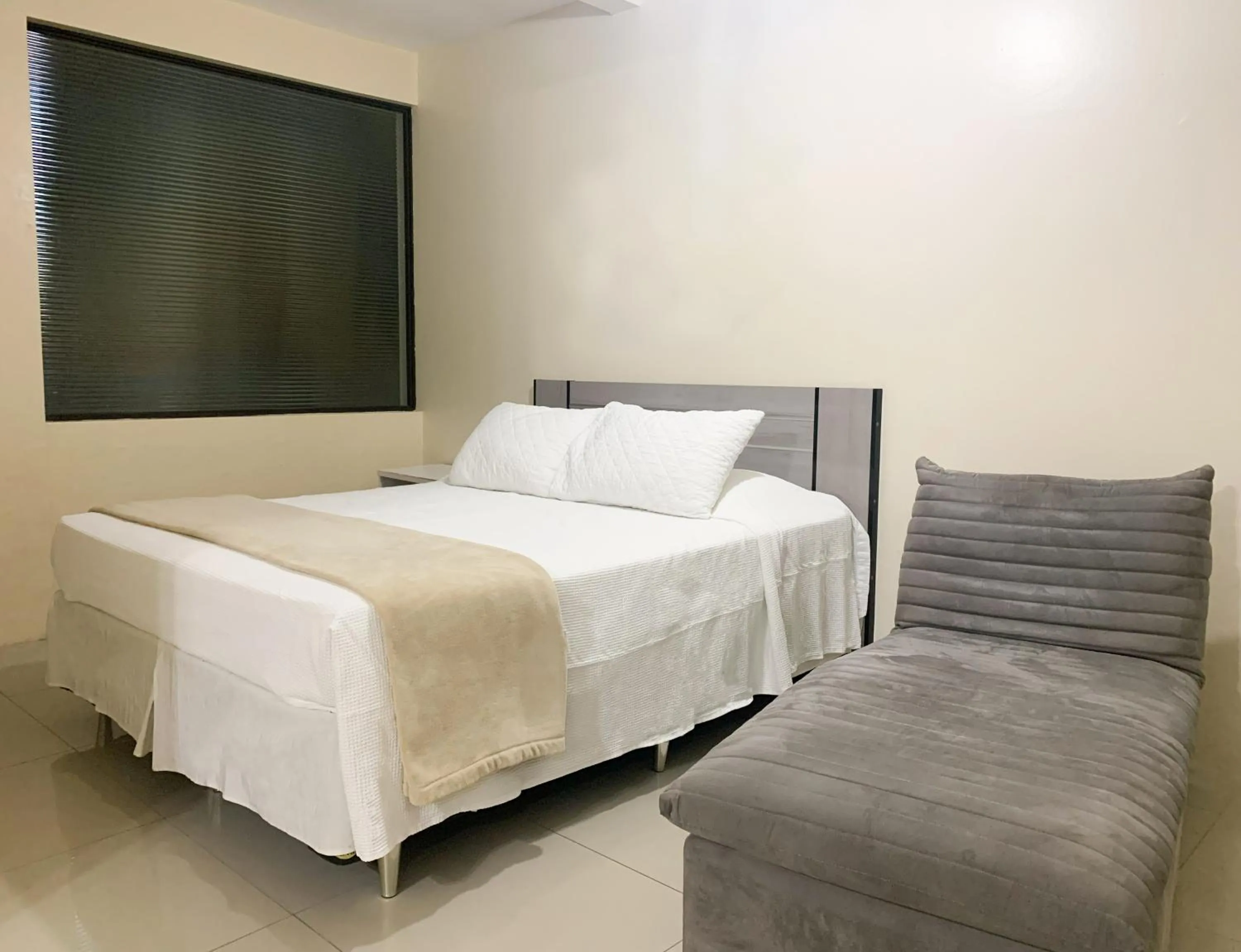 Bed in De Rose Palace Hotel