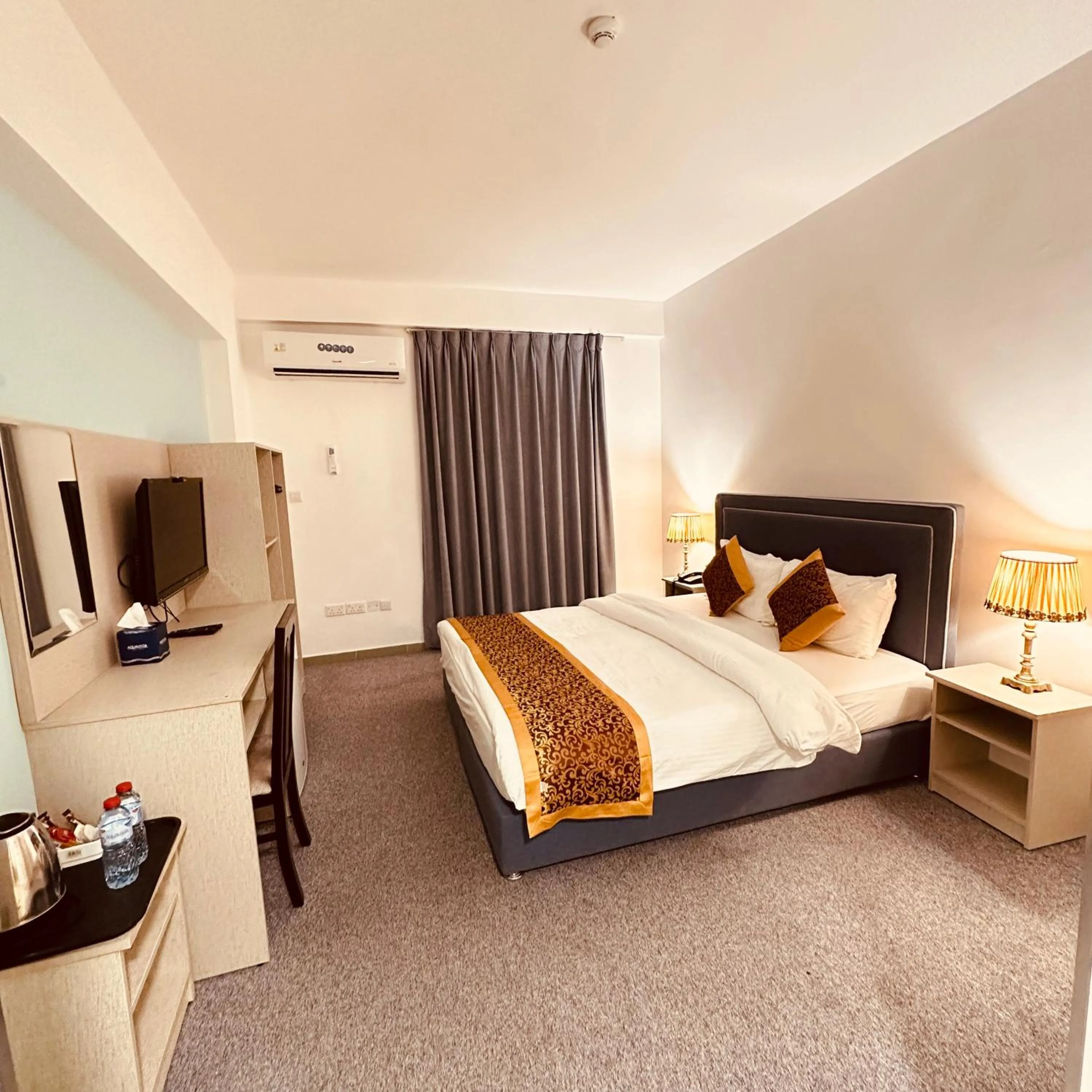 Bed in Aquavista Hotel & Suites