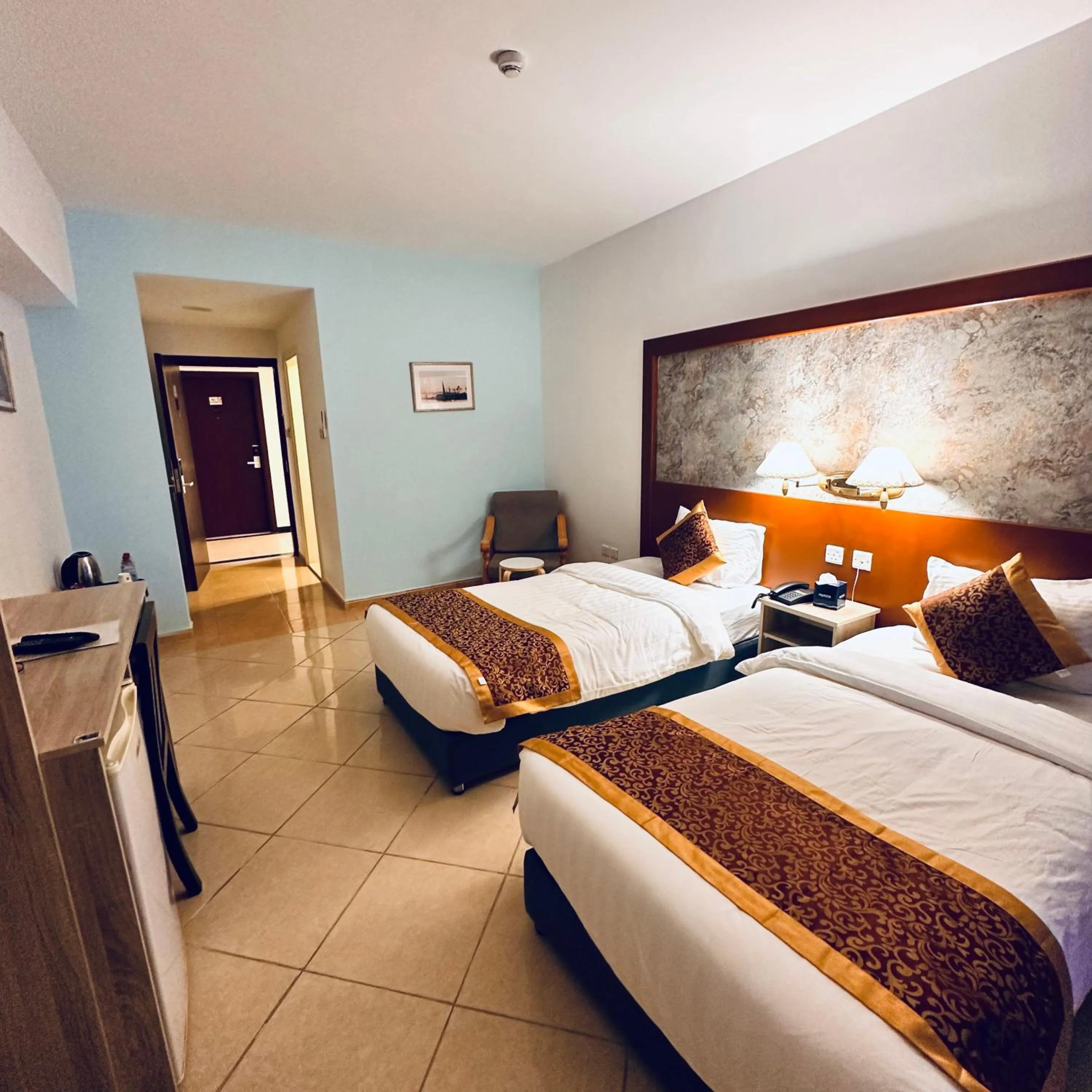 Bed in Aquavista Hotel & Suites