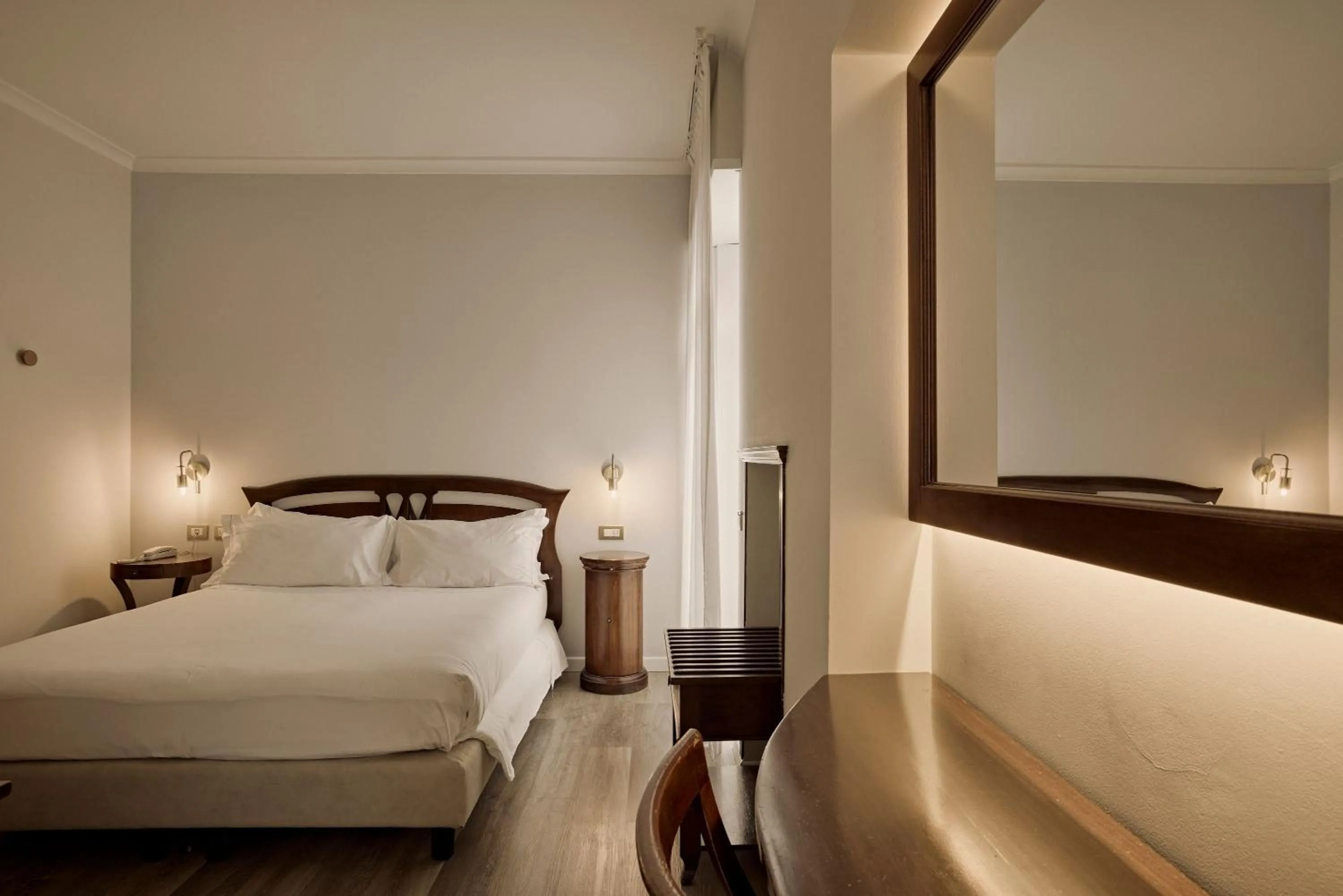 Bed in Hotel Le Mura