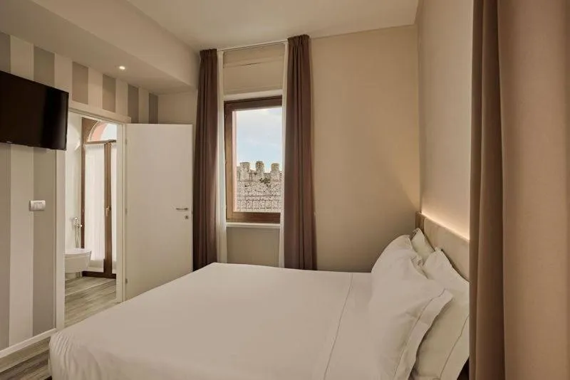 Bed in Hotel Le Mura