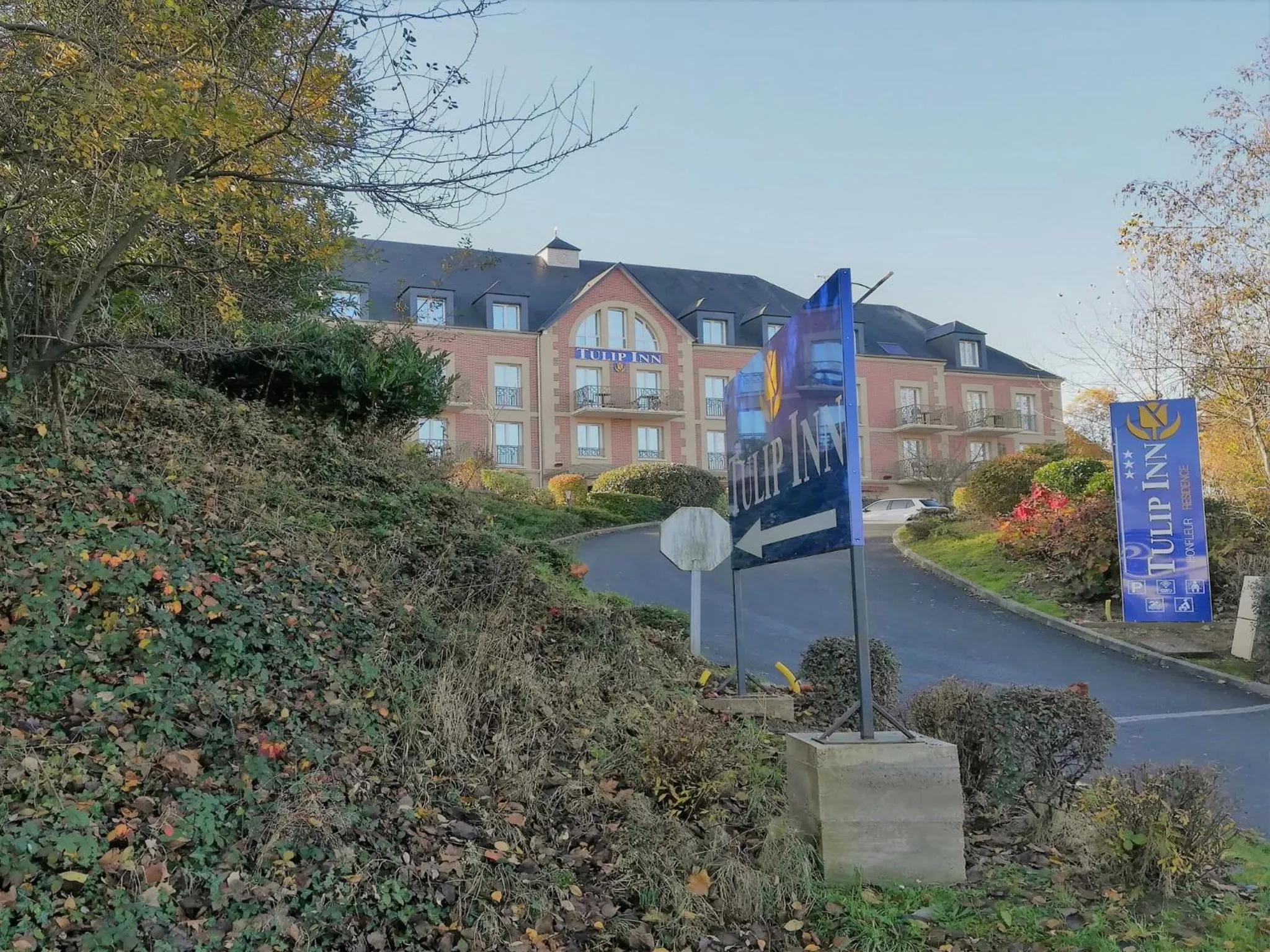 Property logo or sign in Tulip Inn Honfleur Residence & Spa