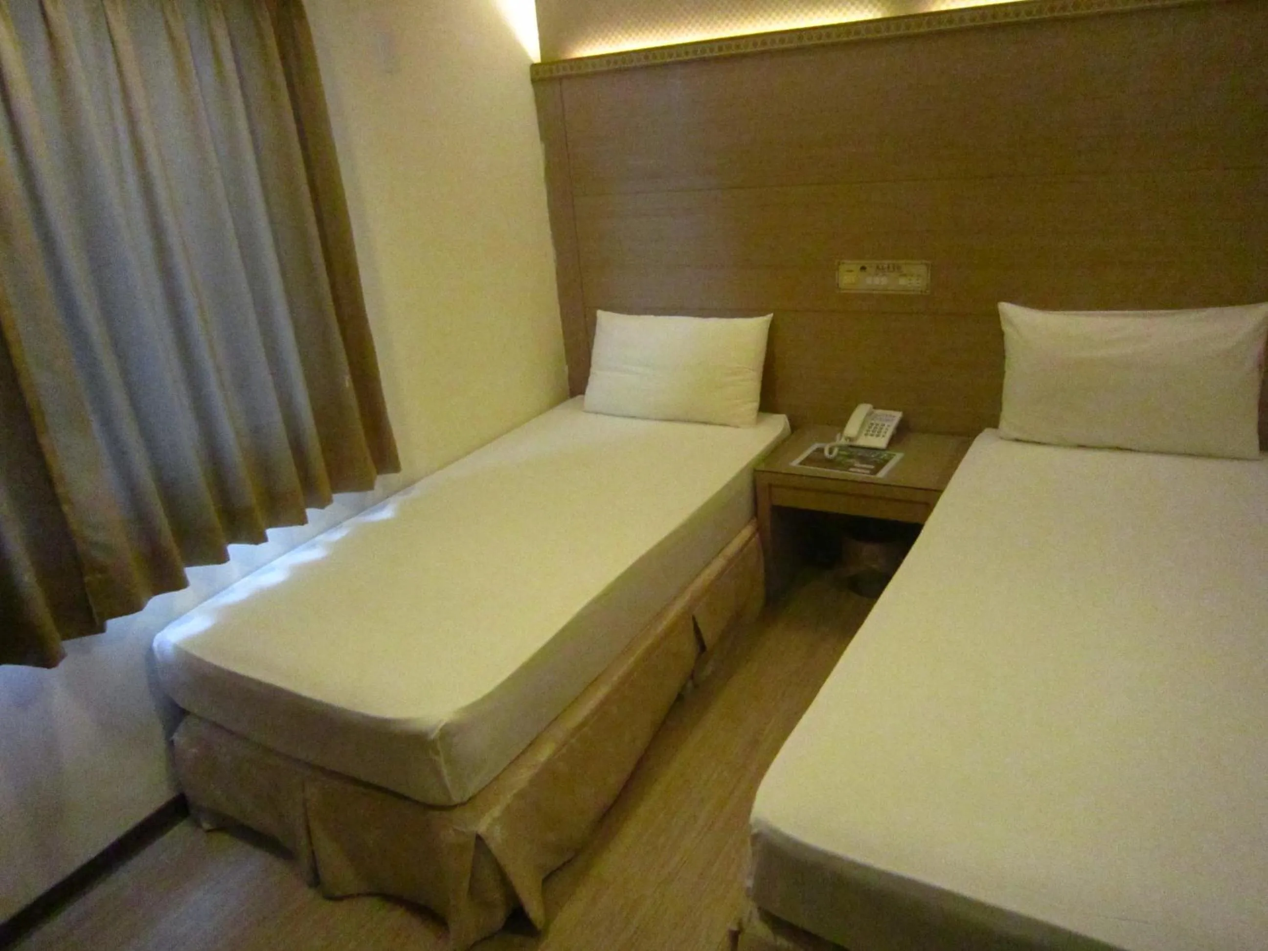 Bed in Gau Shan Ching Hotel