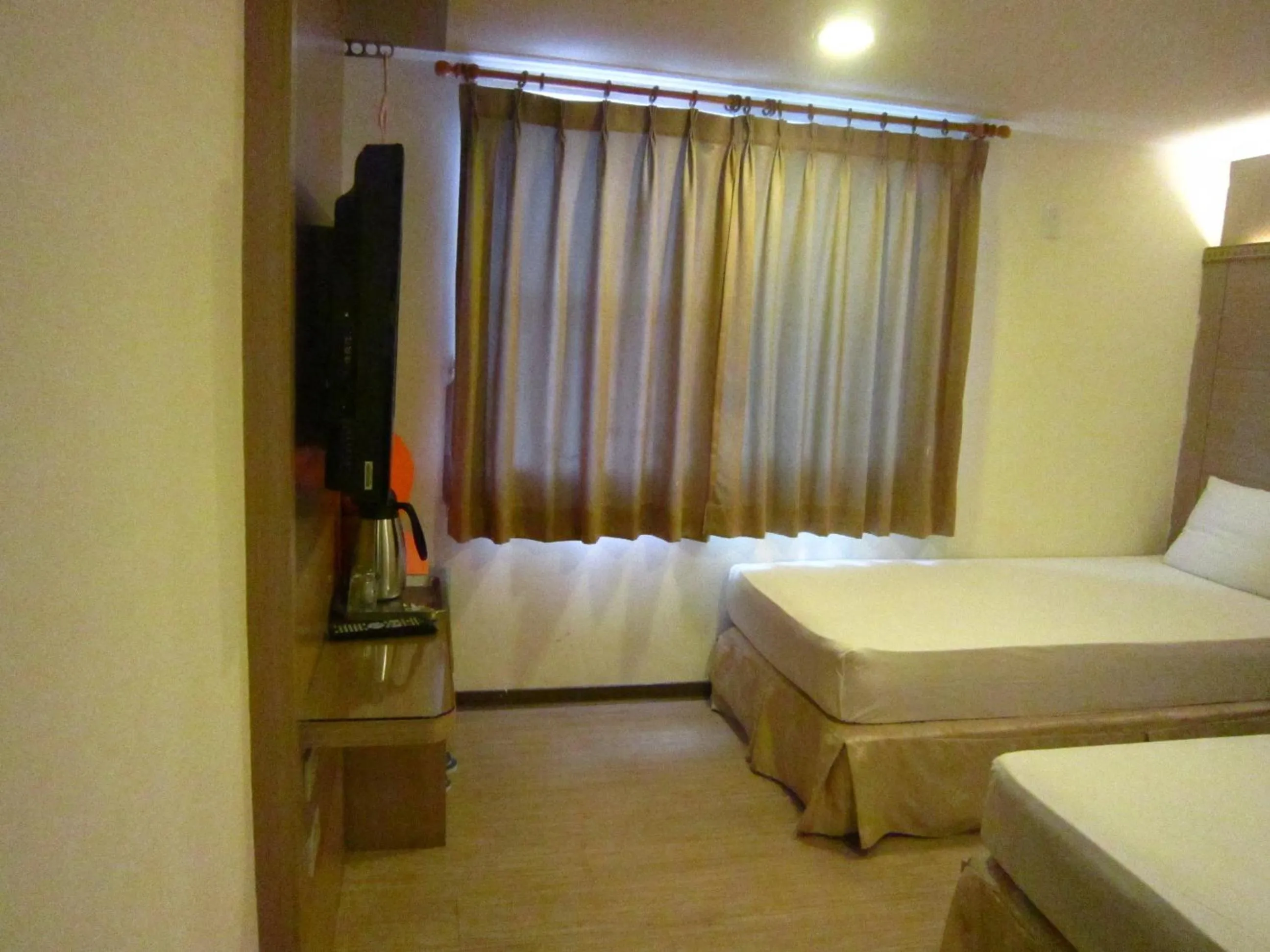 Bed in Gau Shan Ching Hotel