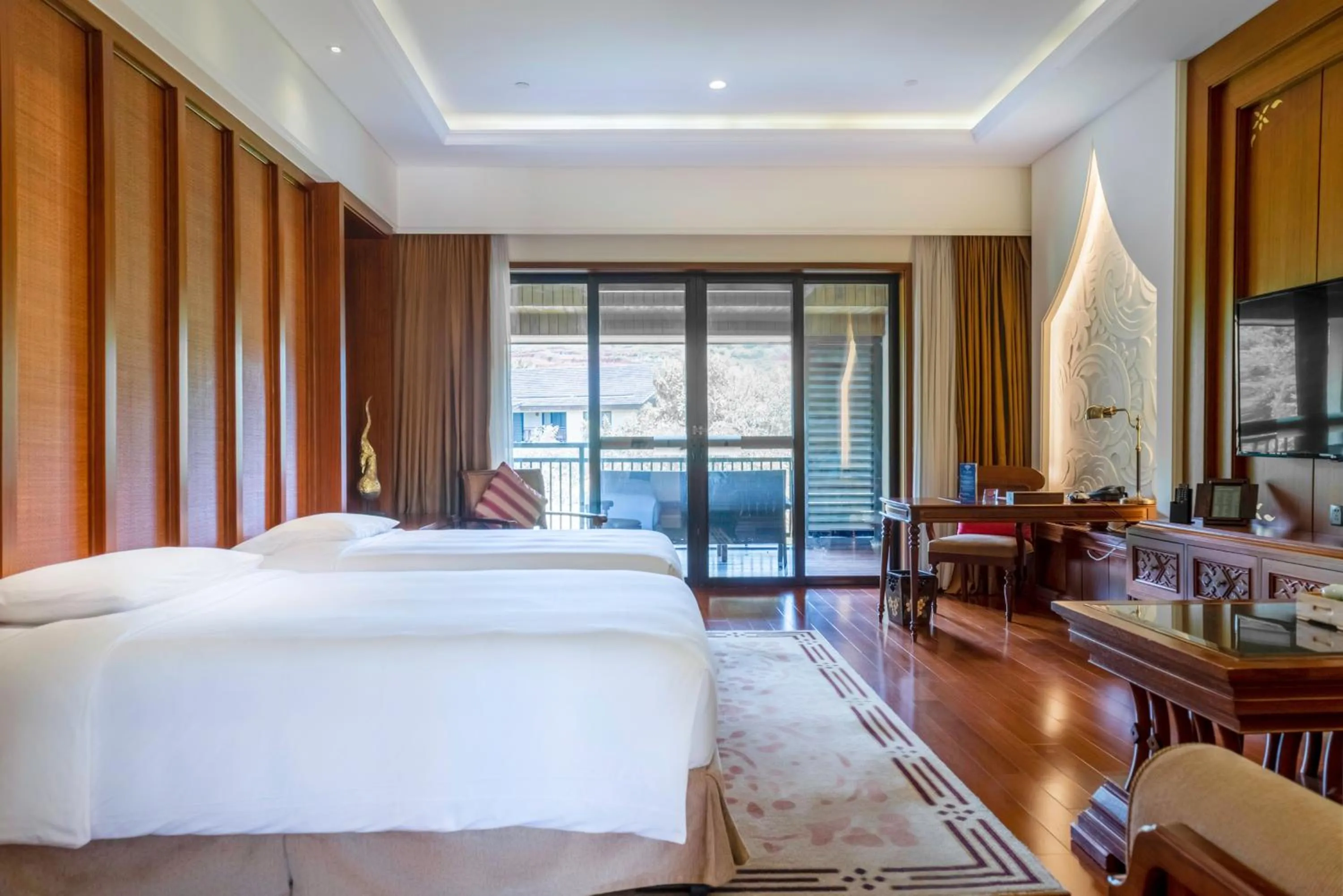 Bed in InterContinental Xishuangbanna Resort by IHG