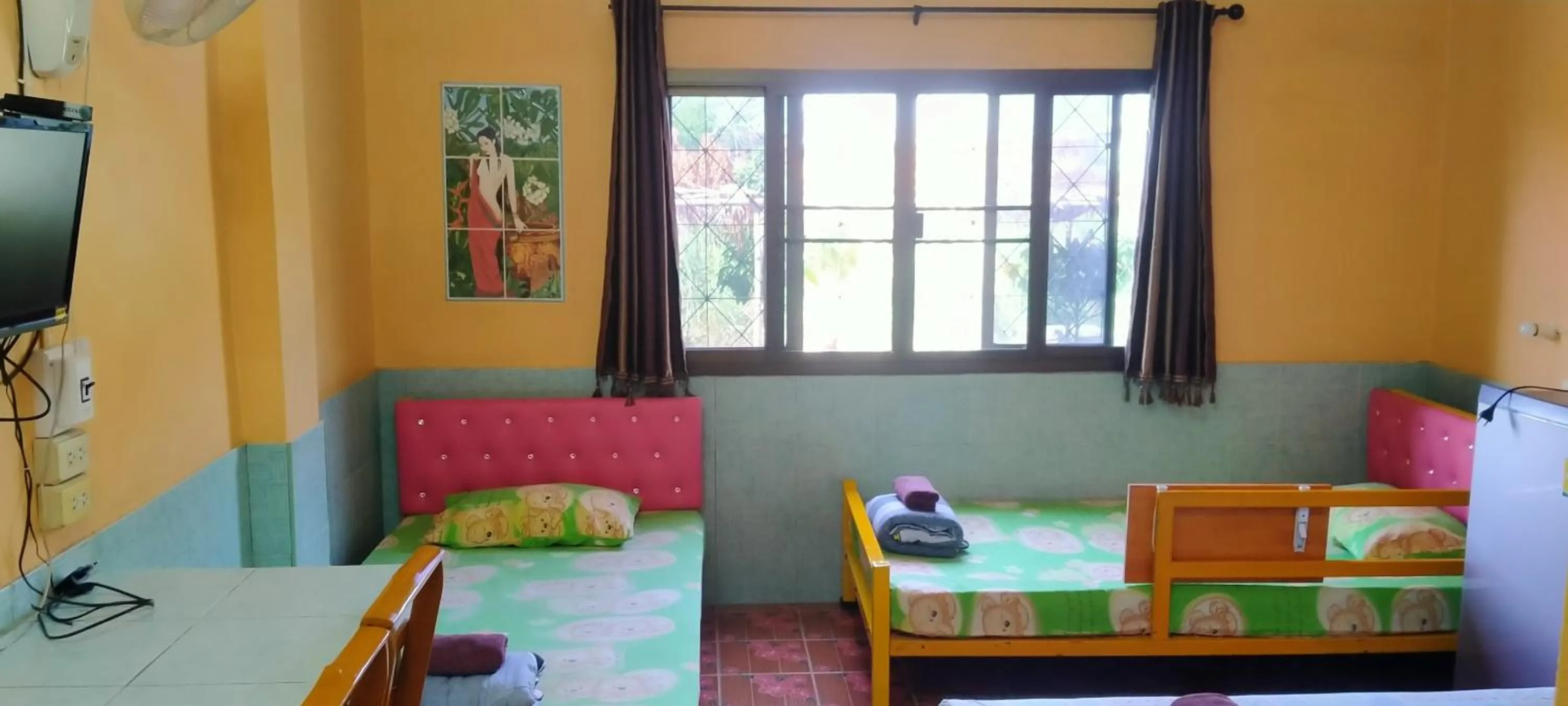 Bed in RuengsriSiri Guesthouse