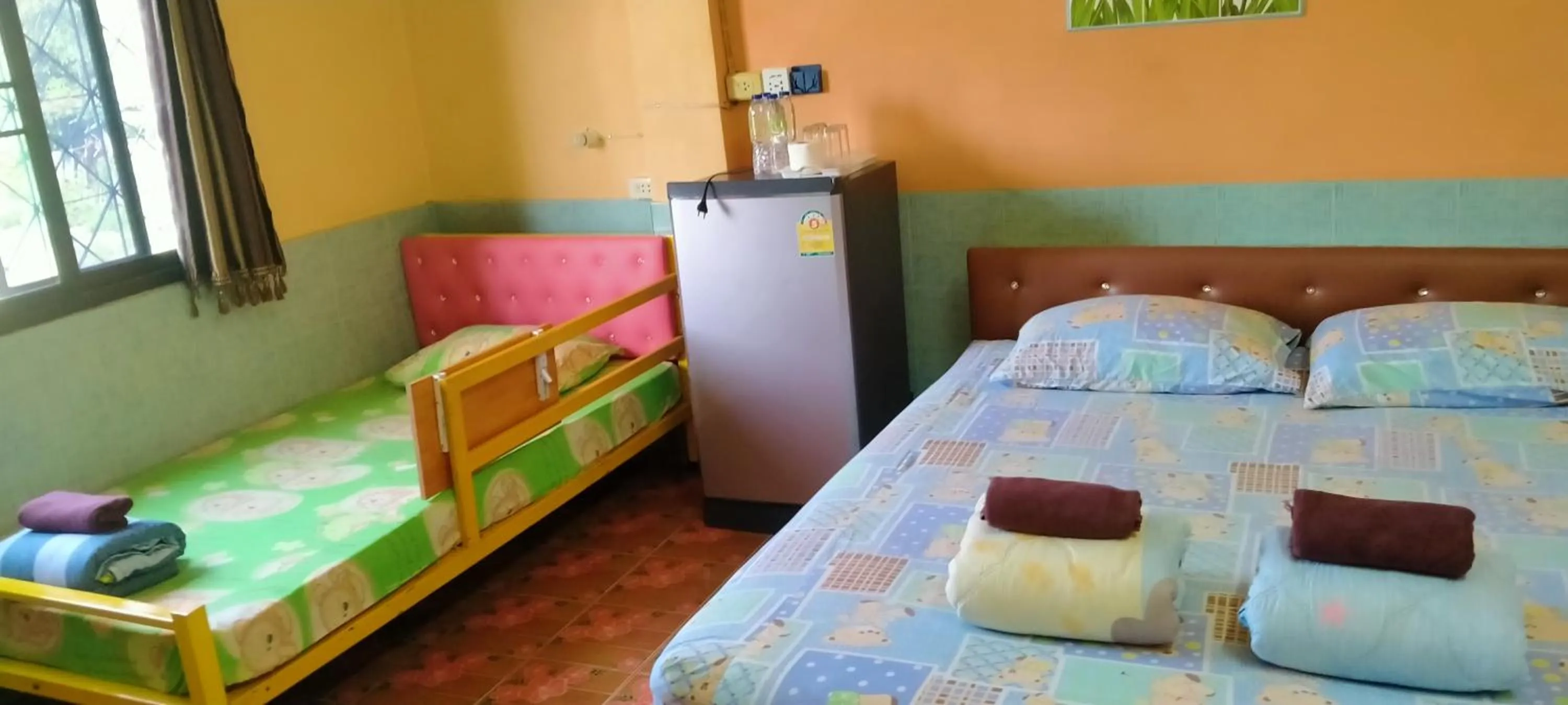 Bed in RuengsriSiri Guesthouse