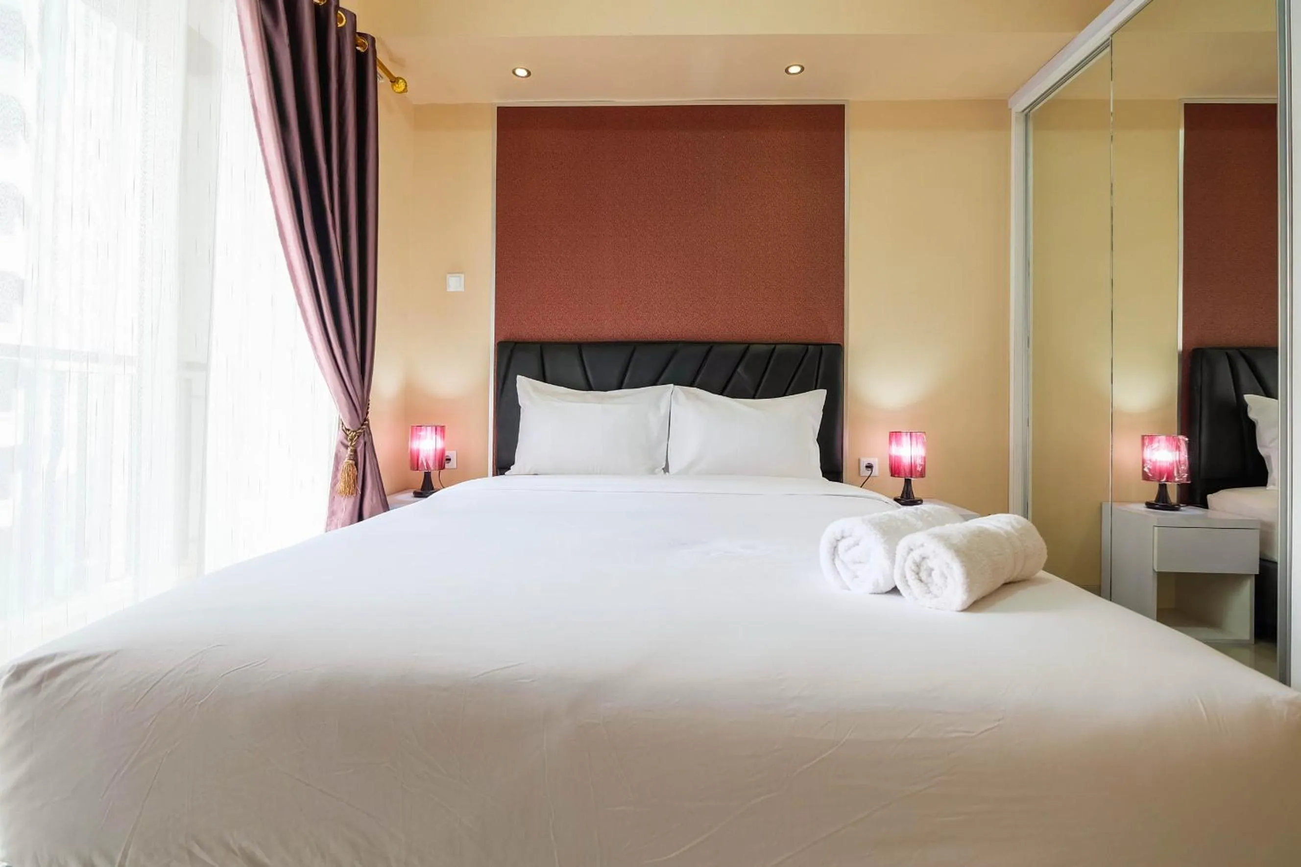 Bed in Bright and Stylish 1BR The Oasis Apartment Cikarang By Travelio