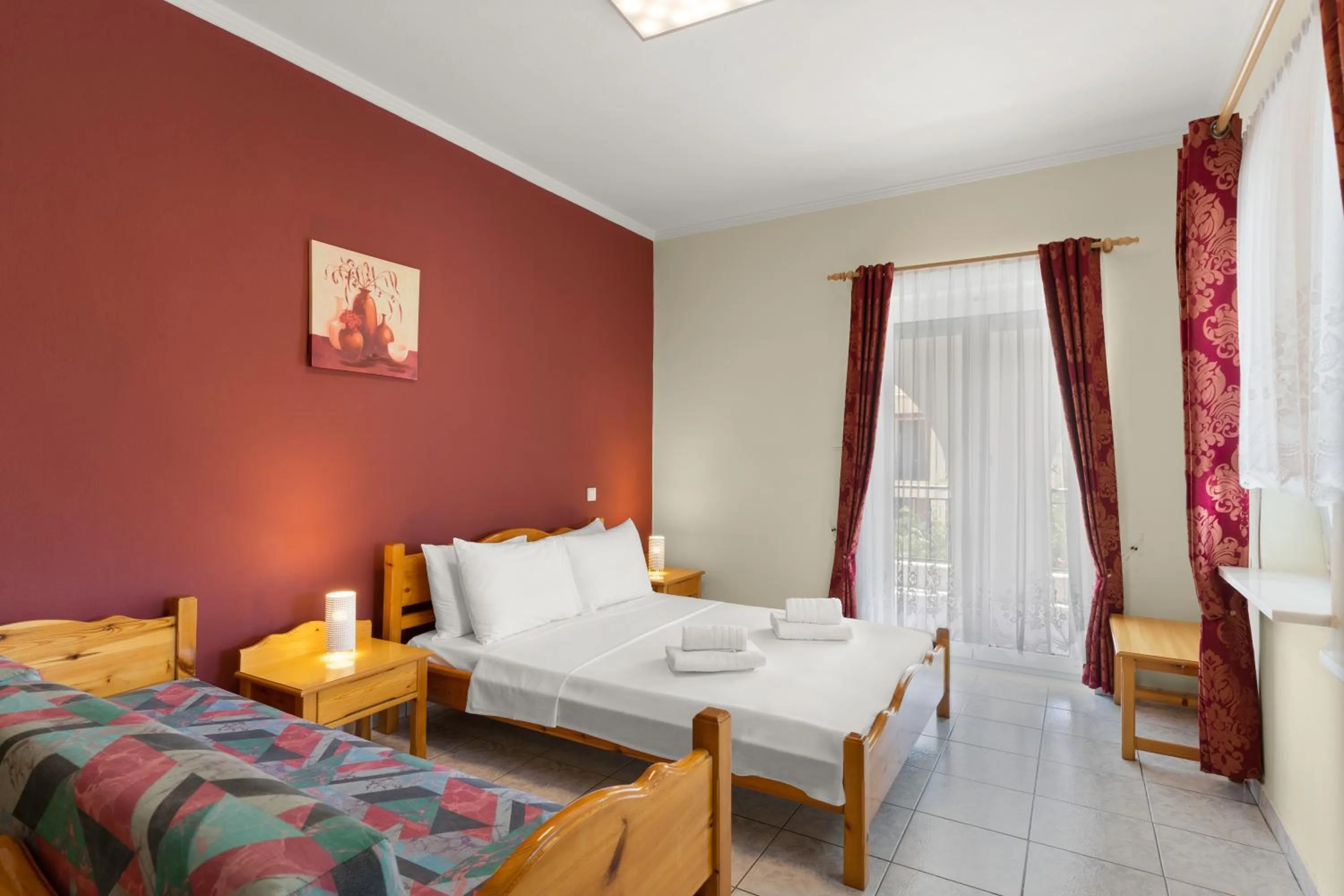 Bed in Delphin Rooms Sivota