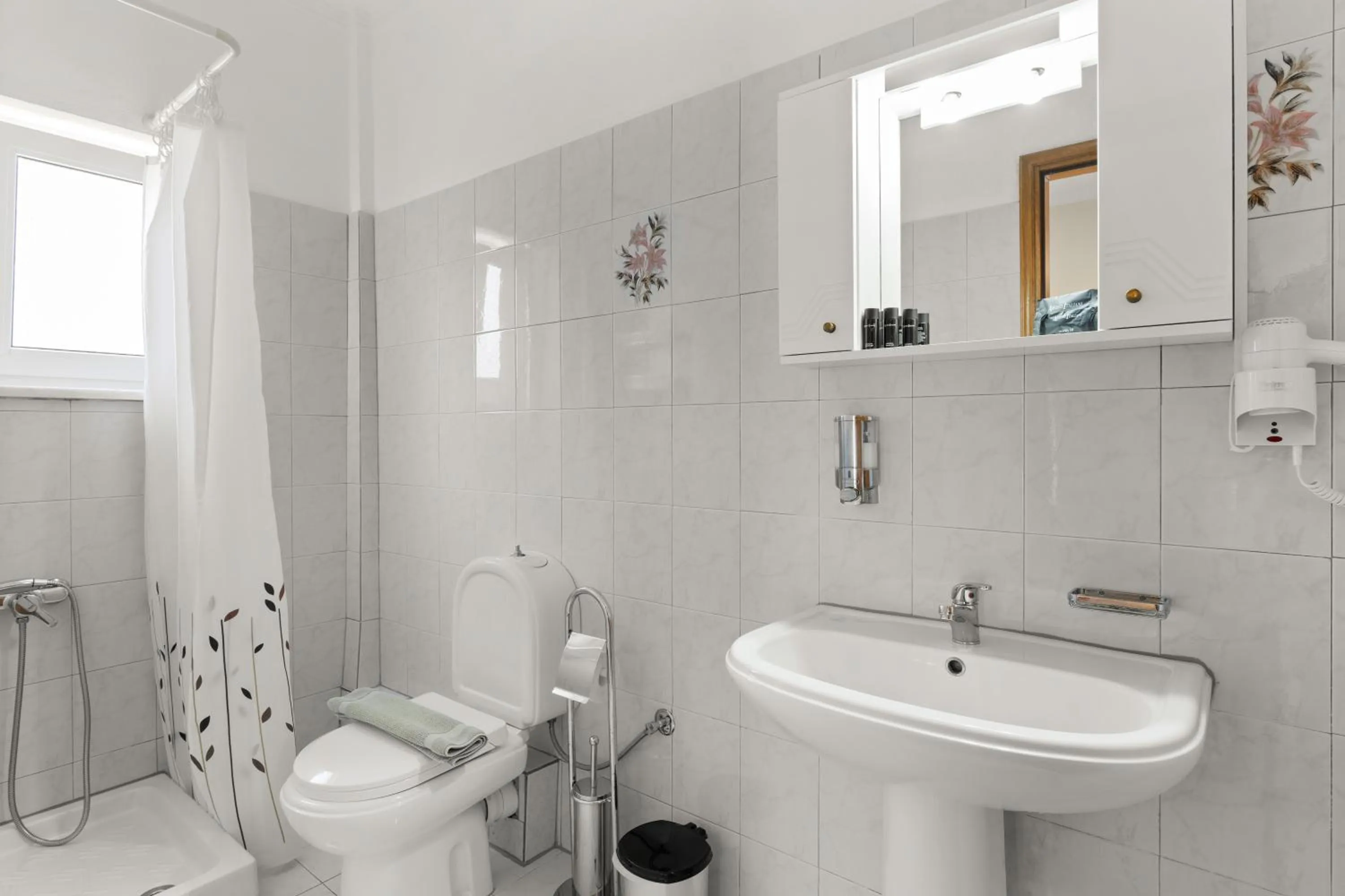 Bathroom in Delphin Rooms Sivota