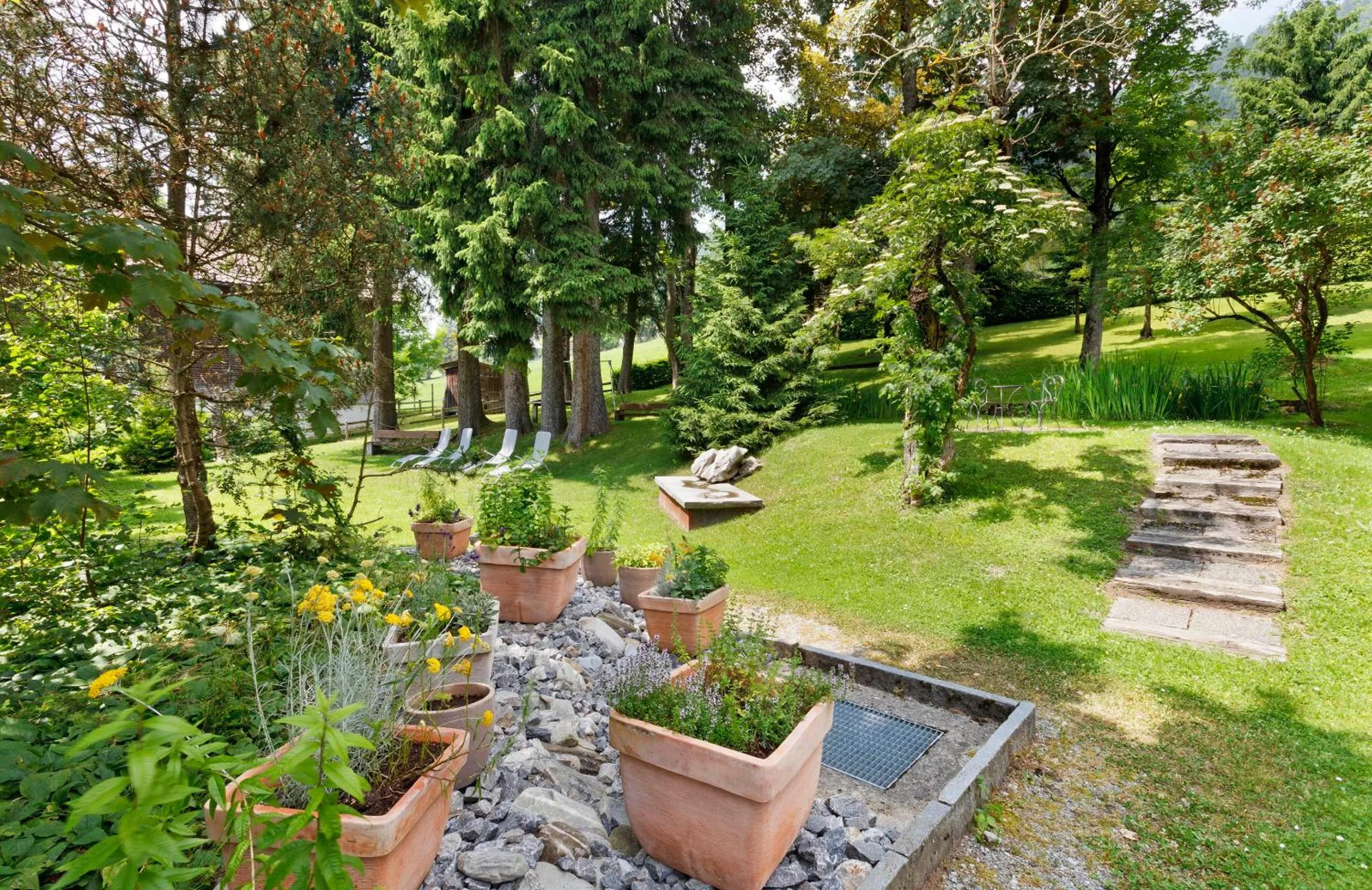 Garden in Hirschen Guesthouse - Village Hotel