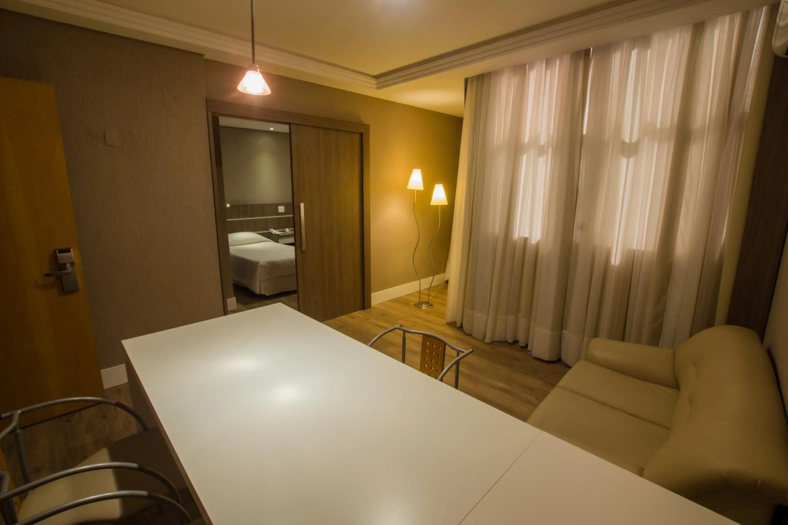 Communal lounge/ TV room, Bed in SJ Royal - San Juan Curitiba