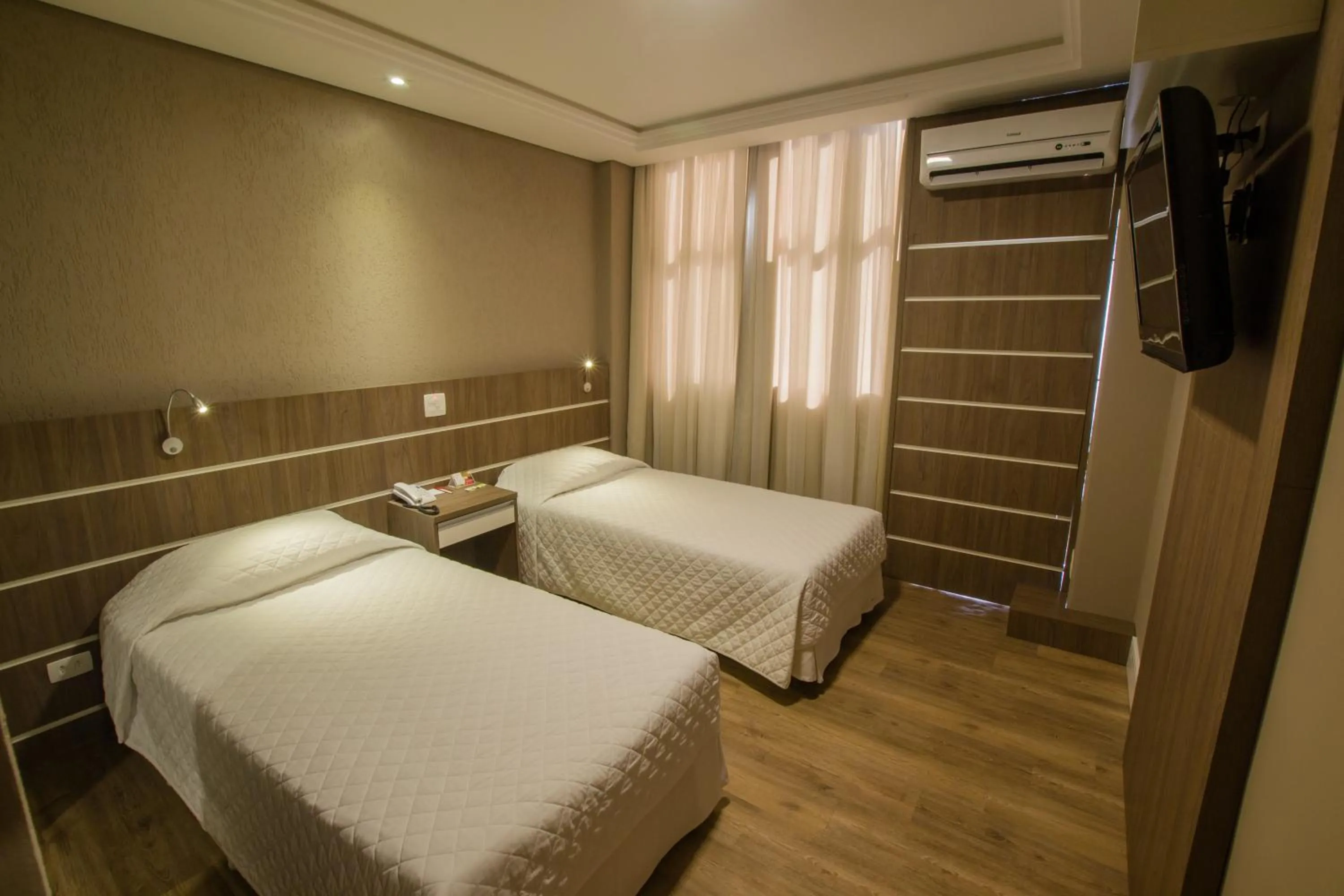 Bed in SJ Royal - San Juan Curitiba