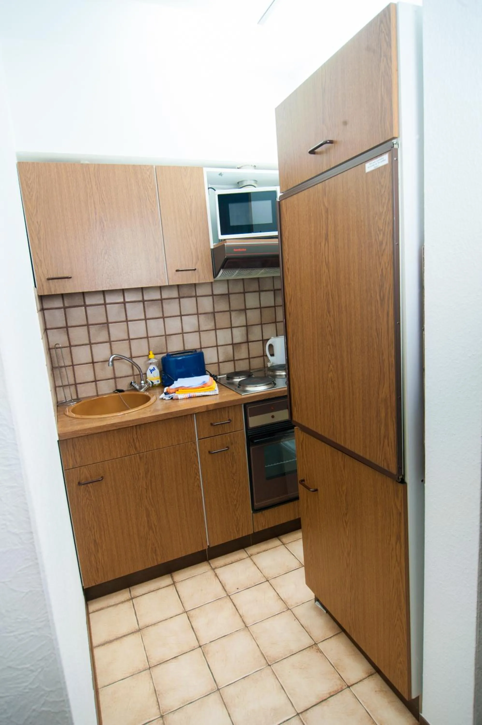 Kitchen or kitchenette in Ferienapartments Schnibbe