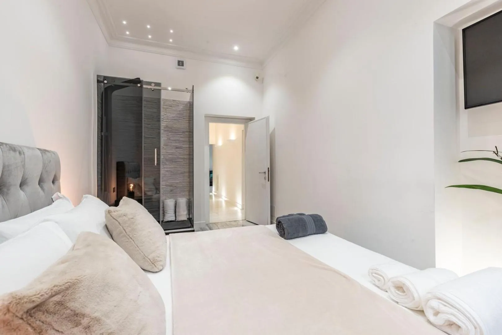 Bed in Daphne Suites