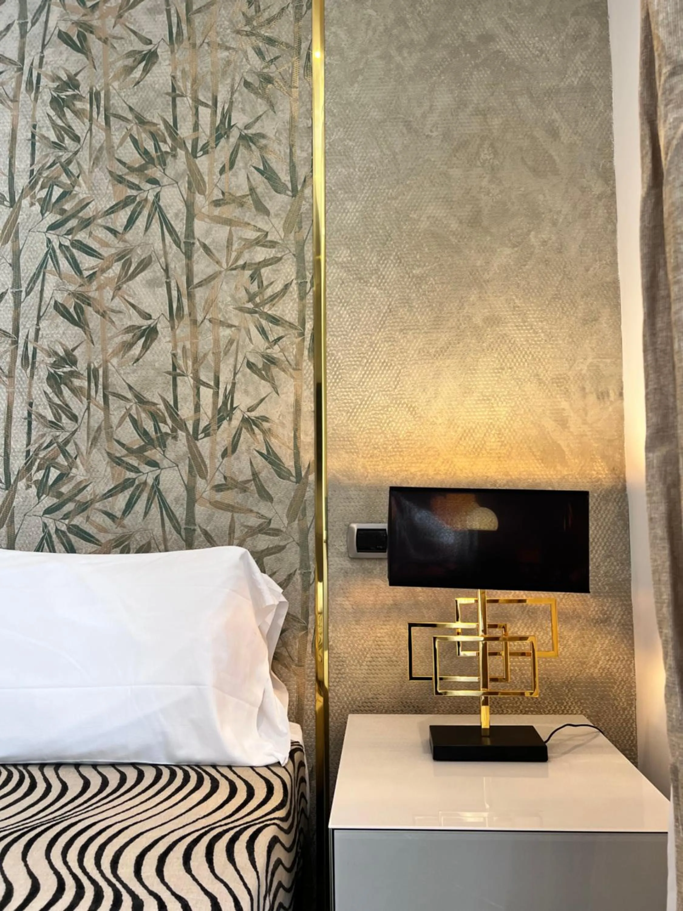 Bed in Daphne Suites