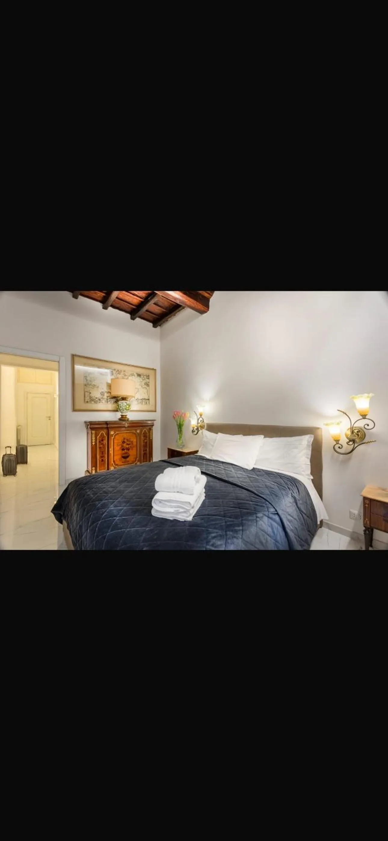 Bed in Daphne Suites