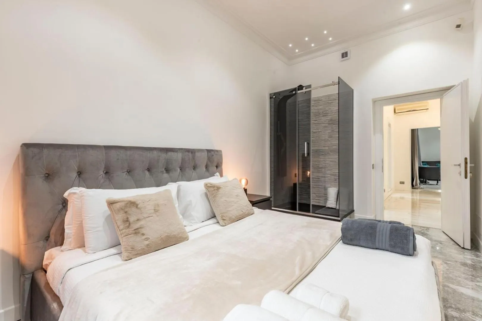 Bed in Daphne Suites