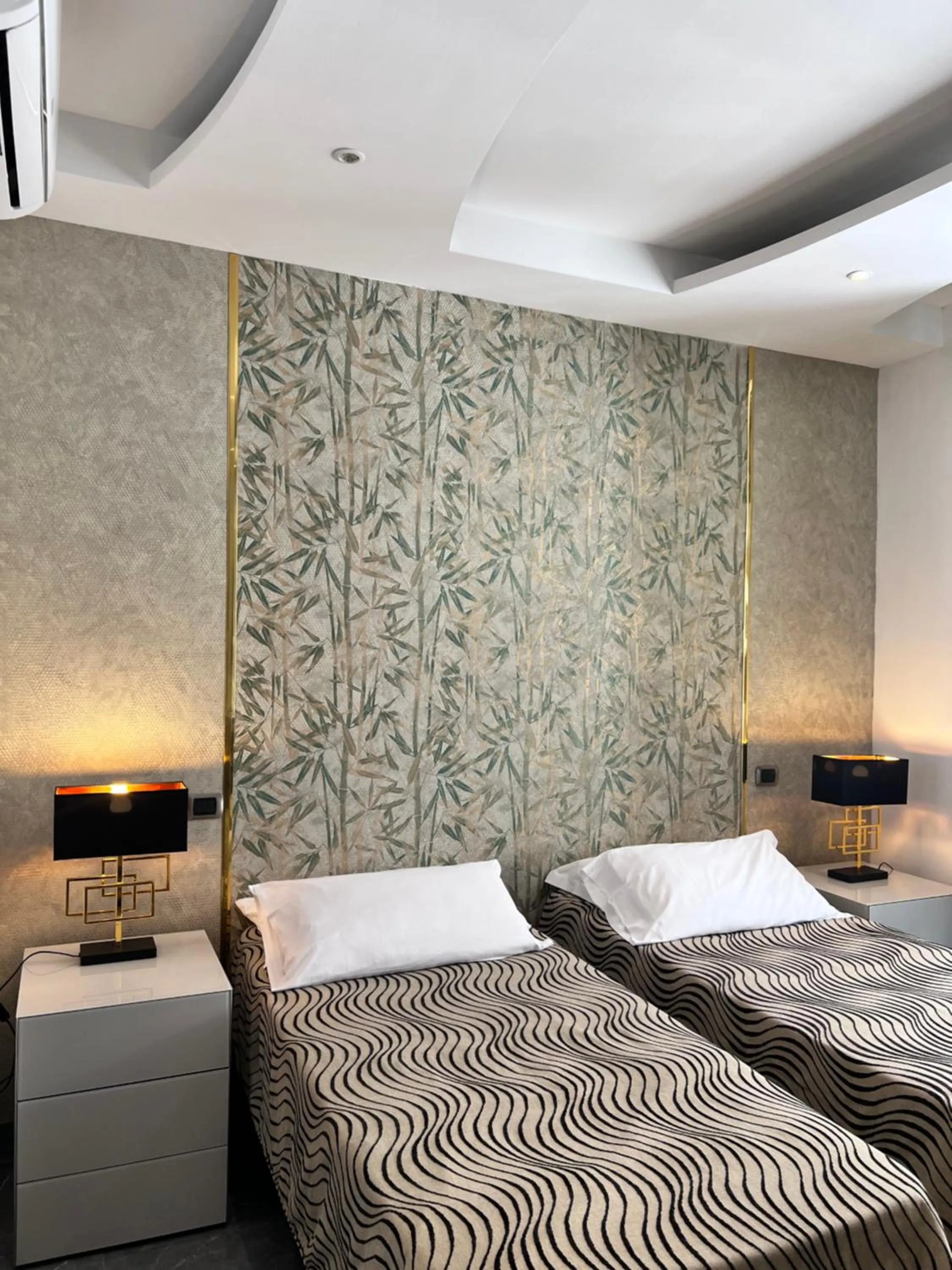 Bed in Daphne Suites