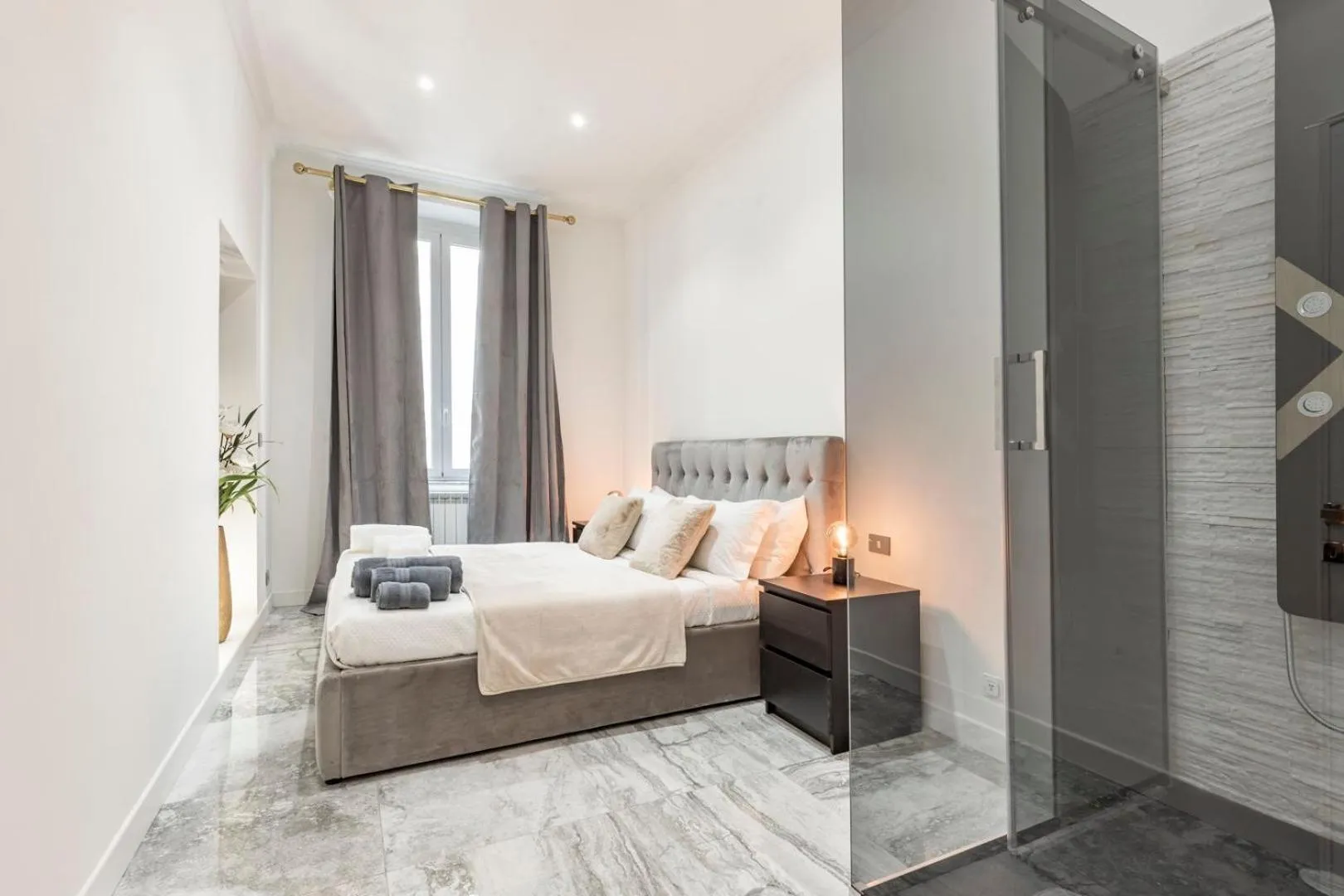 Bed in Daphne Suites