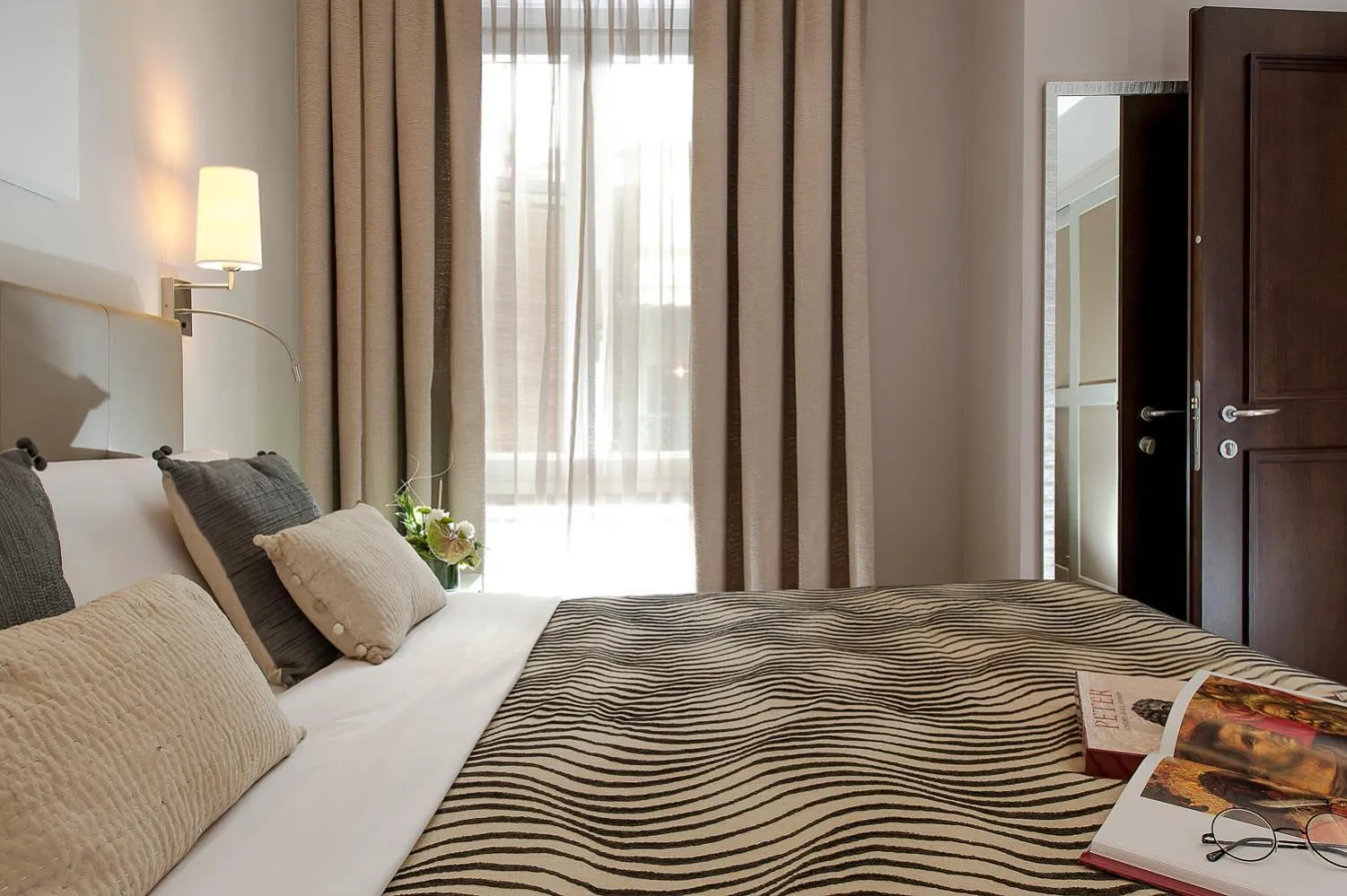 Bed in Daphne Suites