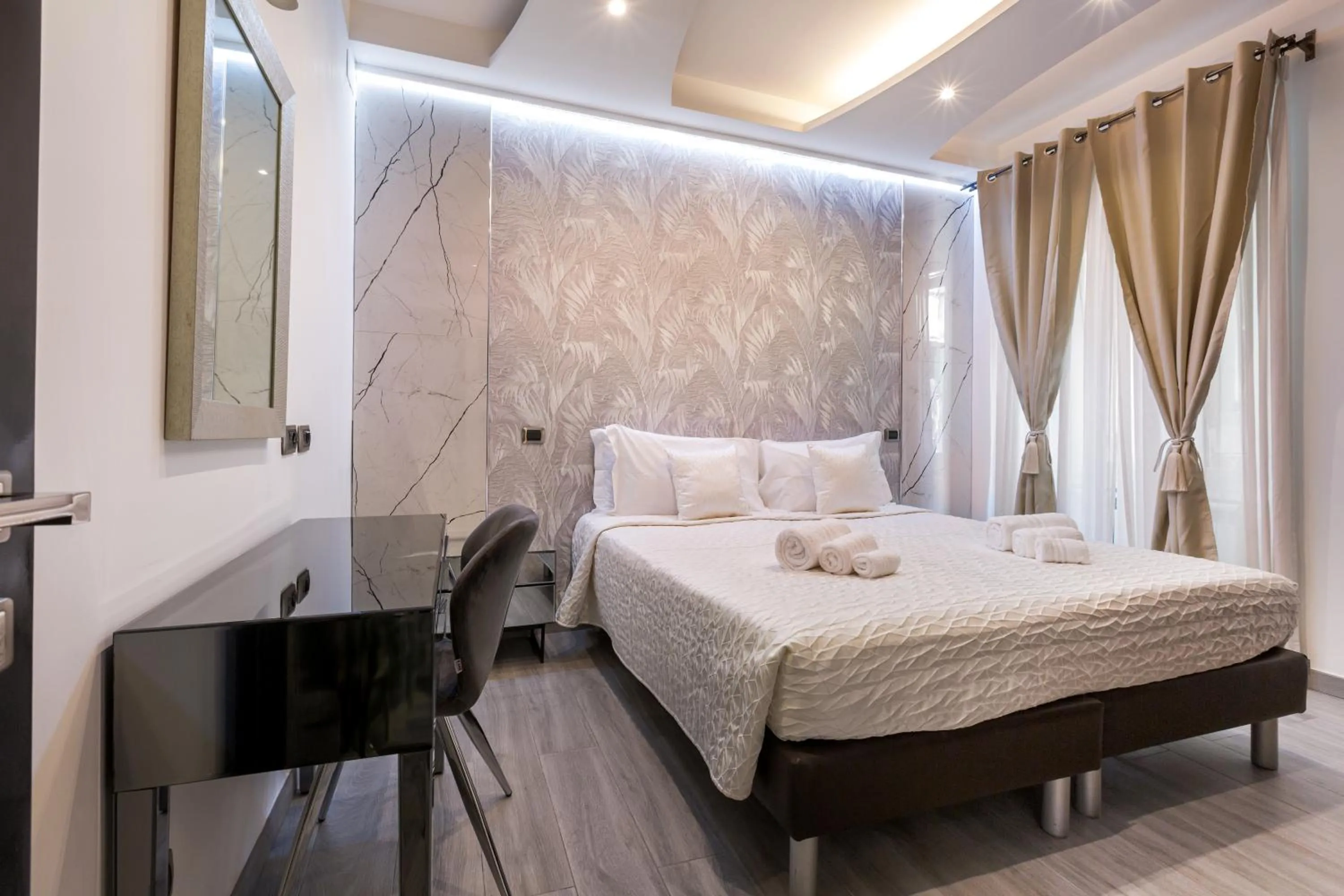 Bed in Daphne Suites
