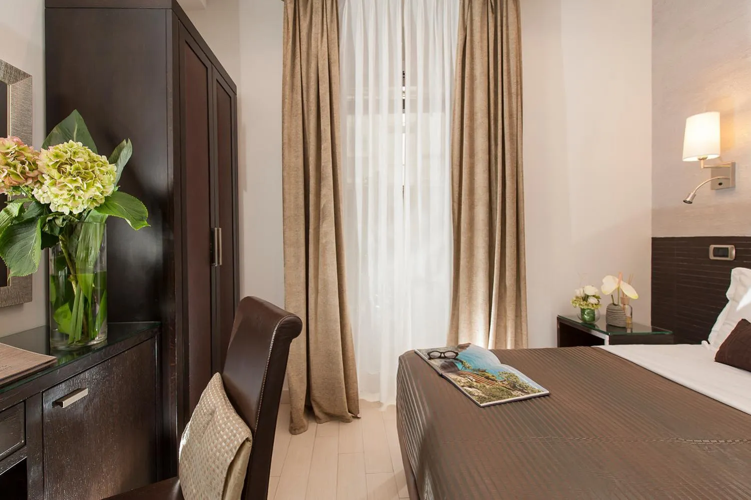 Bed in Daphne Suites