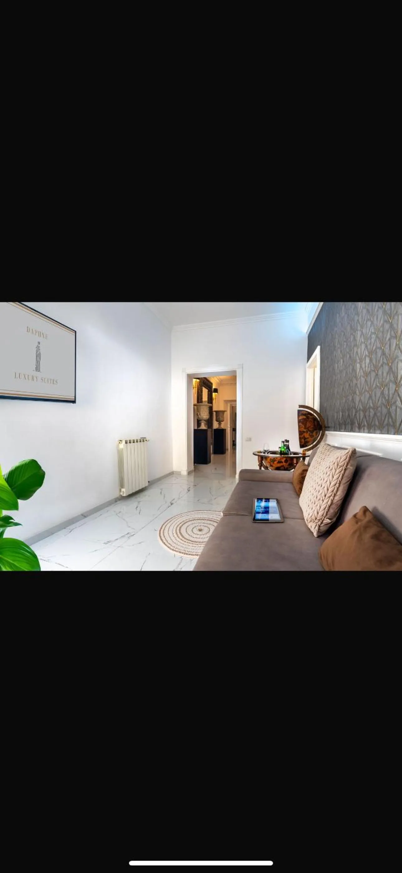 Bed in Daphne Suites