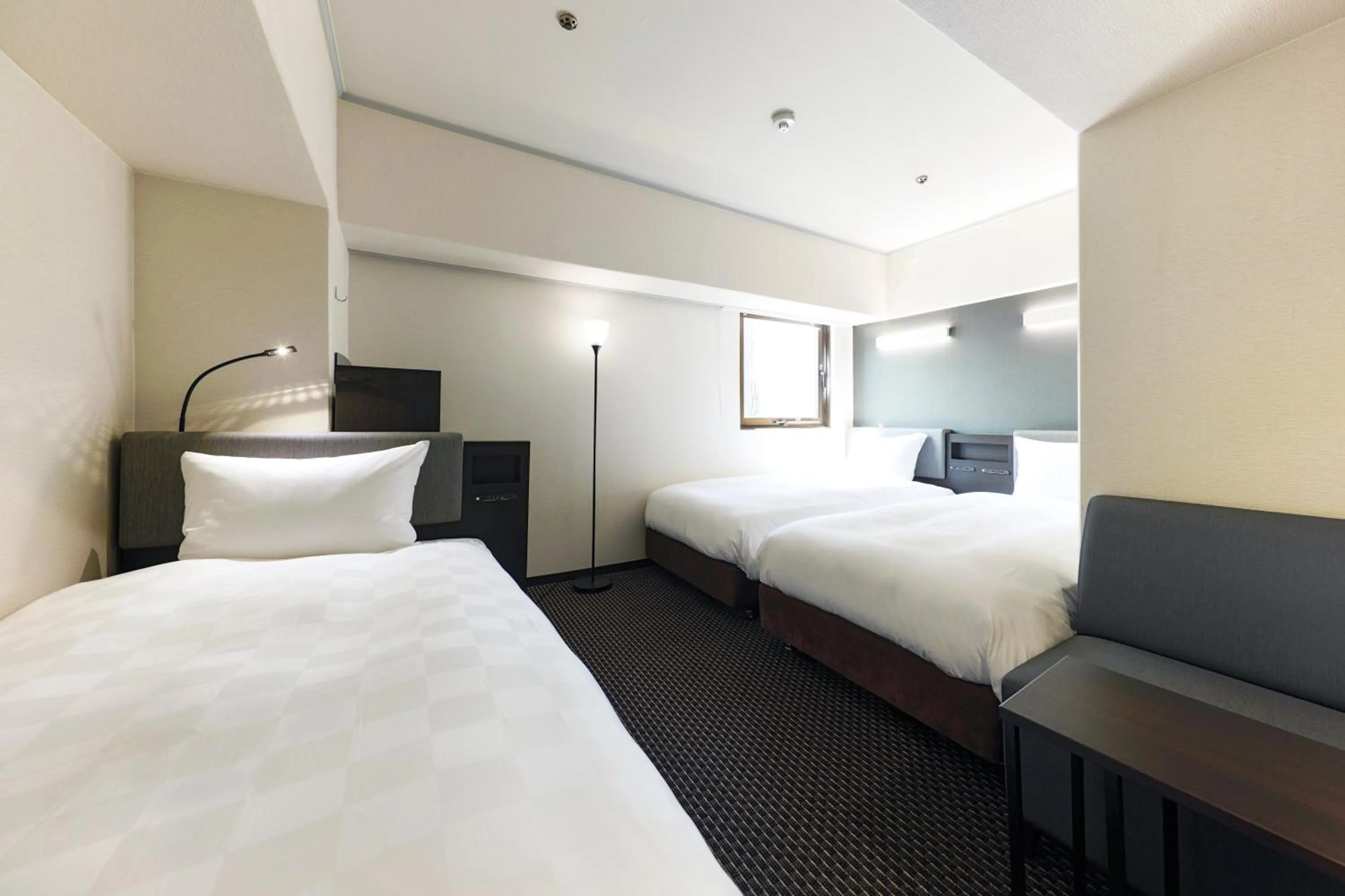 Bed in Hotel Consort Shin-Osaka