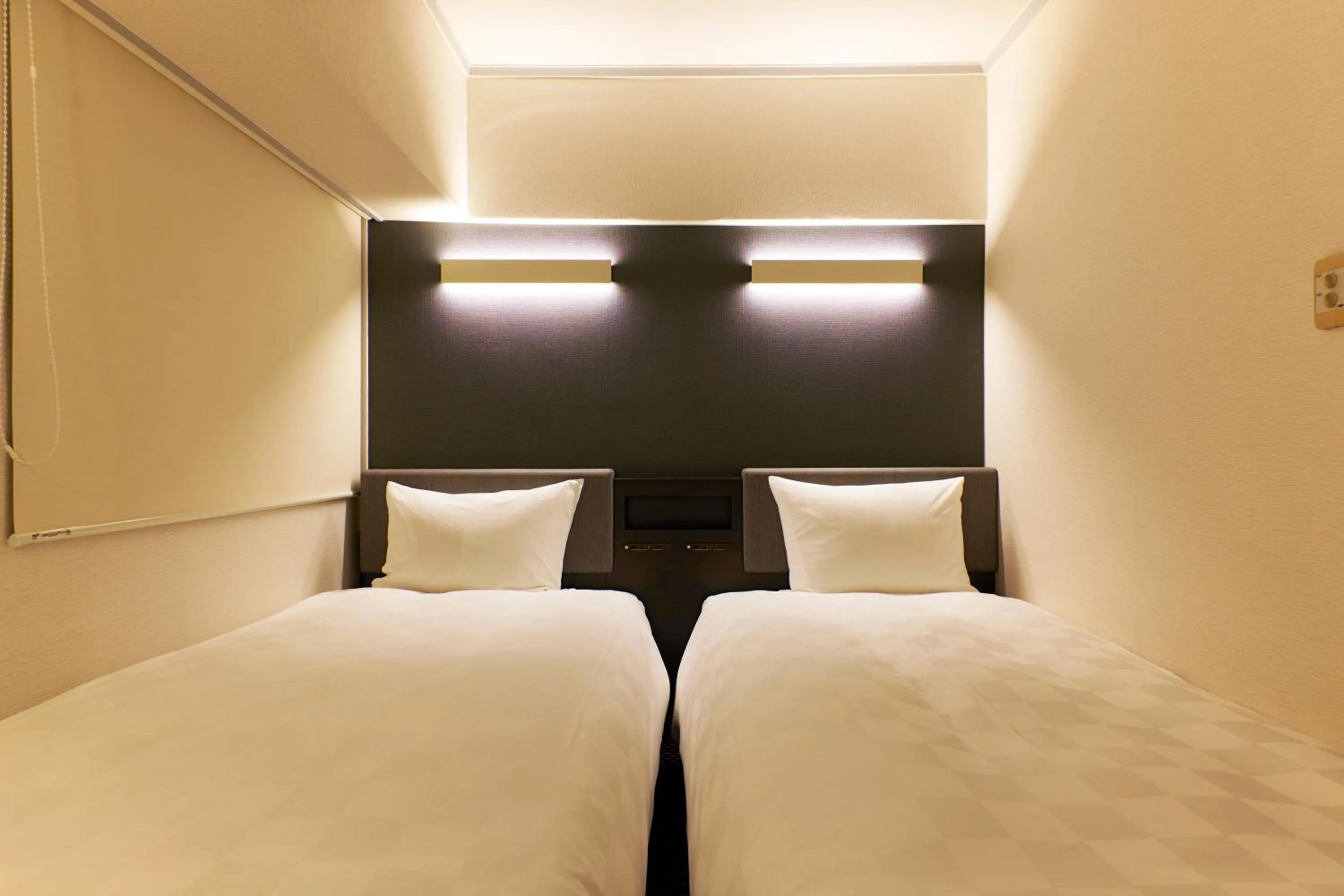 Bed in Hotel Consort Shin-Osaka