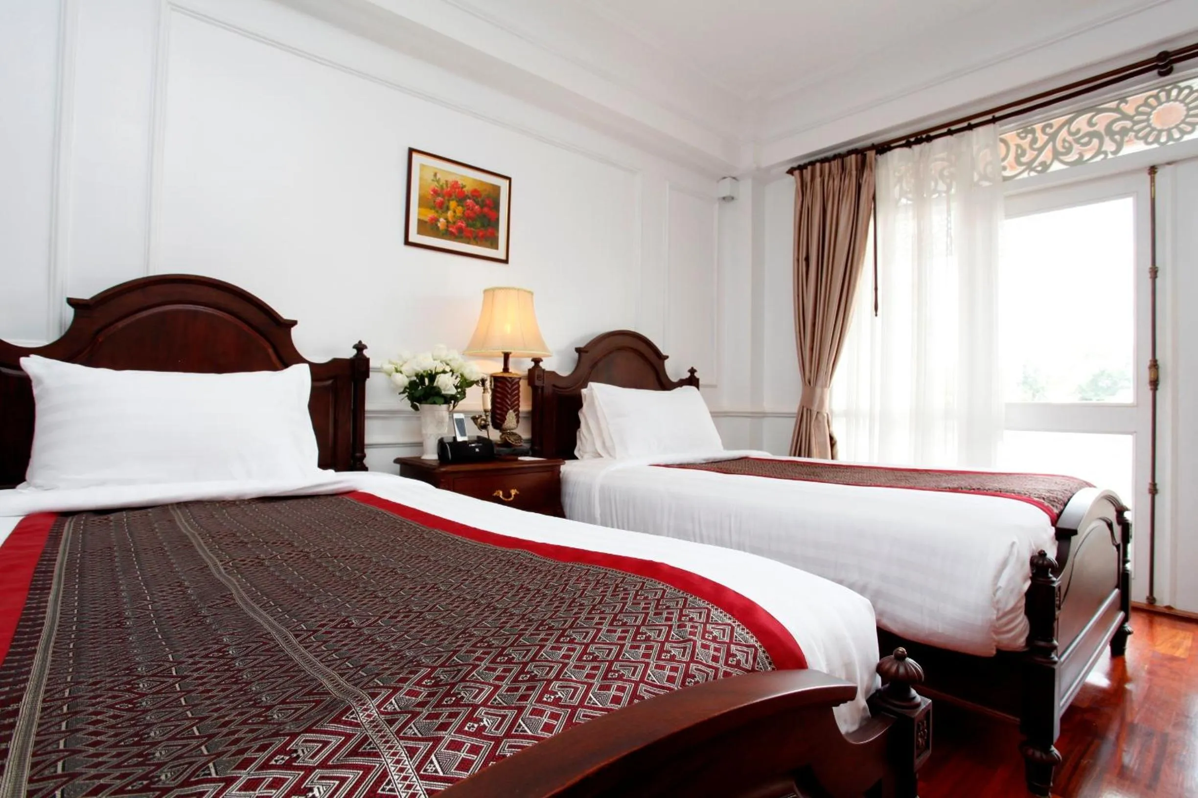 Bed in Dhavara Boutique Hotel